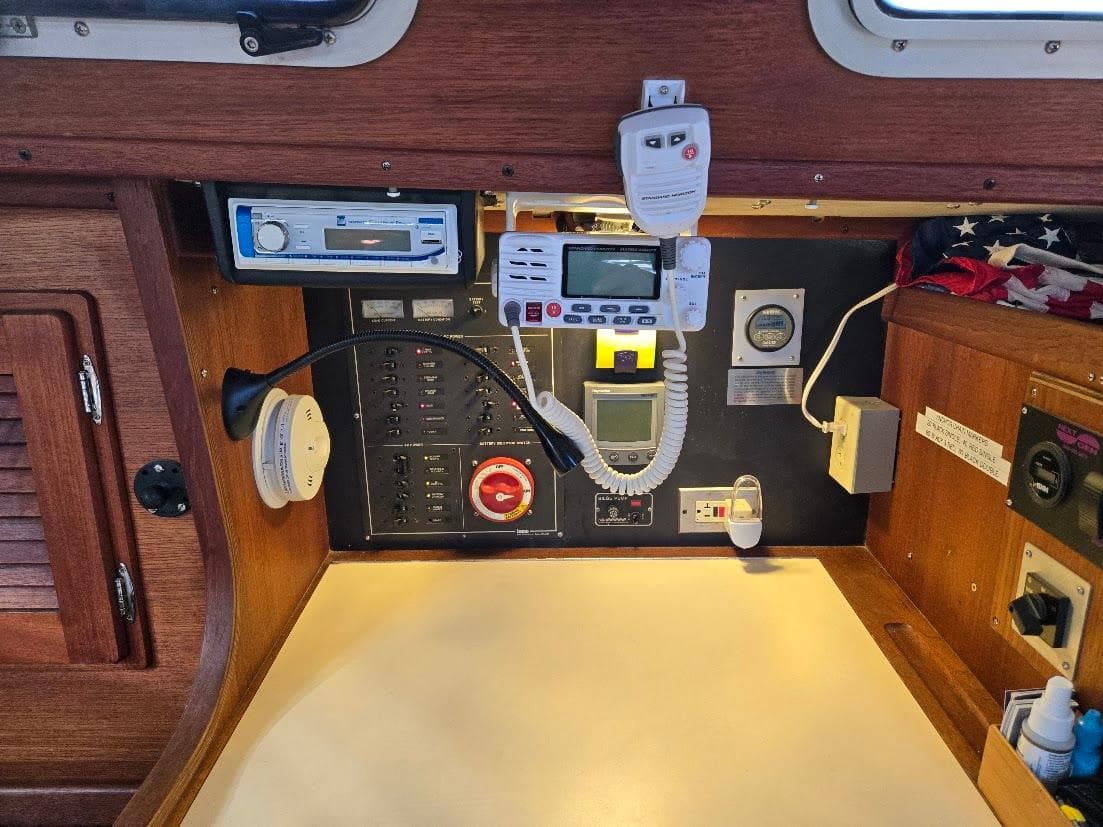 Control panel of a 1991 Freedom F-38 sailboat with navigation and communication equipment.