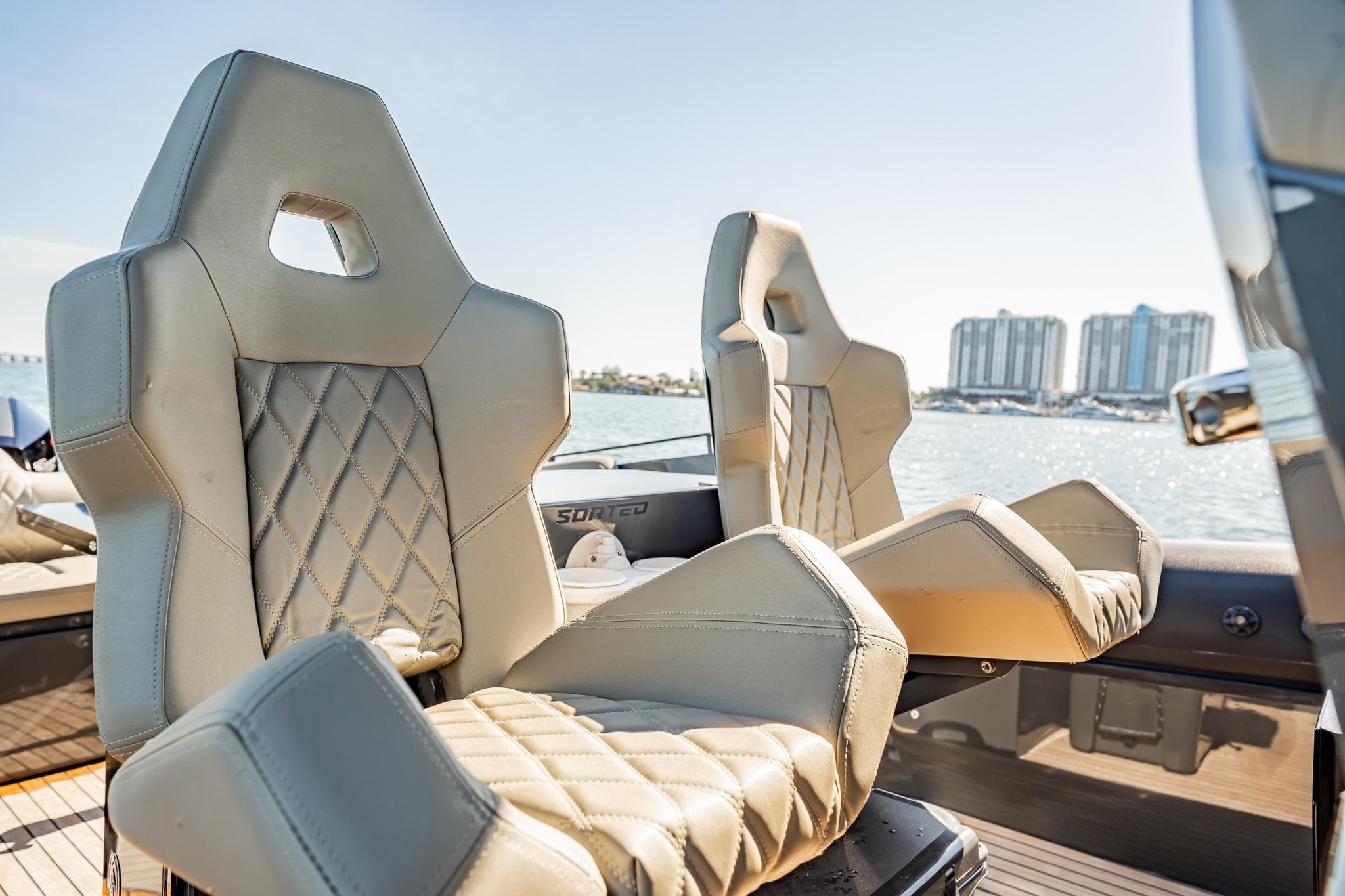 Luxurious seating on 2023 Skipper-BSK 38NC boat with waterfront view.