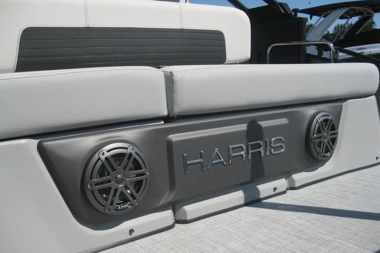 2023 Harris FloteBote 250 Solstice boat interior with speakers and seating.