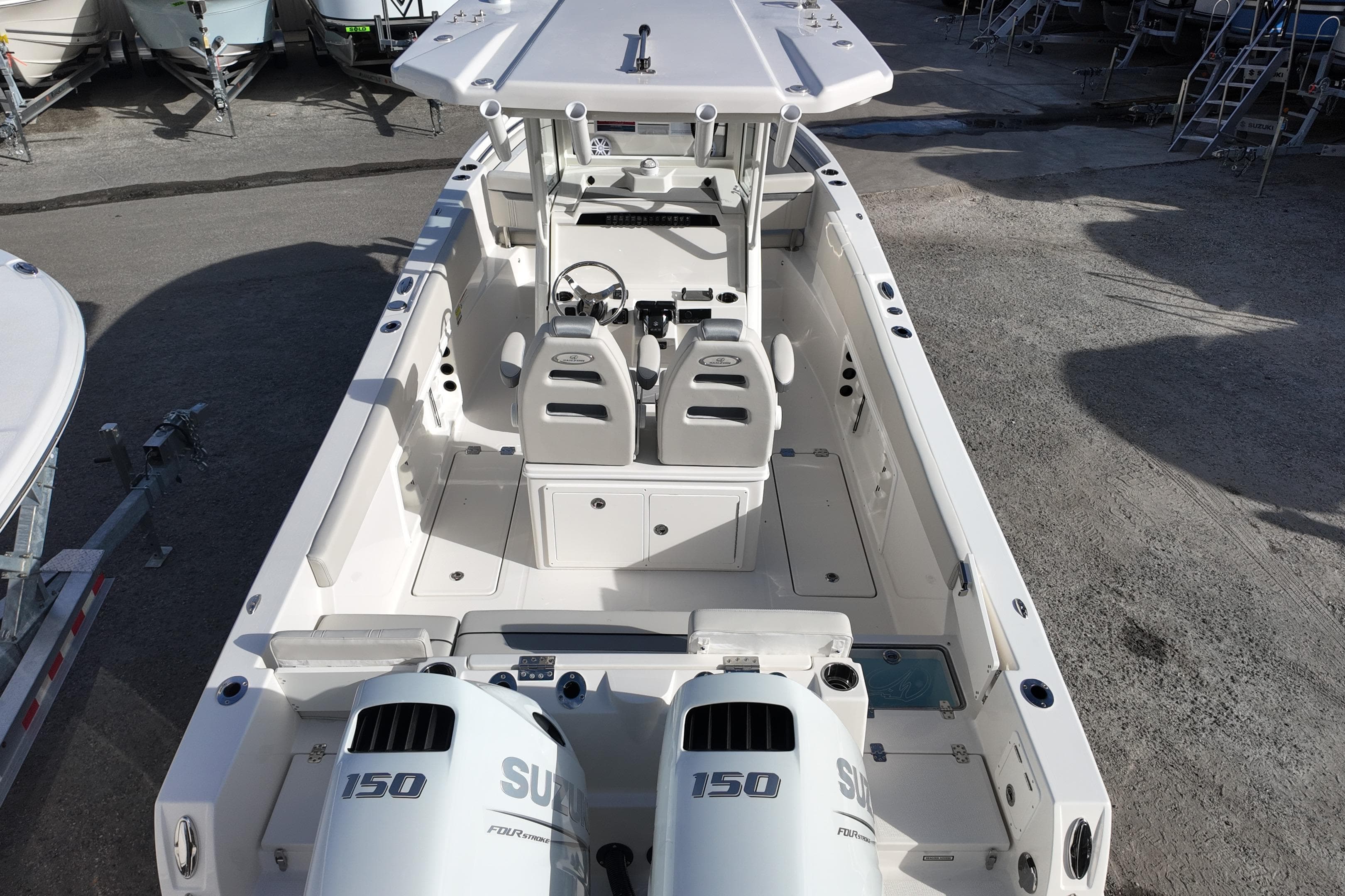 2026 Sailfish 252 CC boat with dual Suzuki 150 engines, spacious deck, and modern helm.