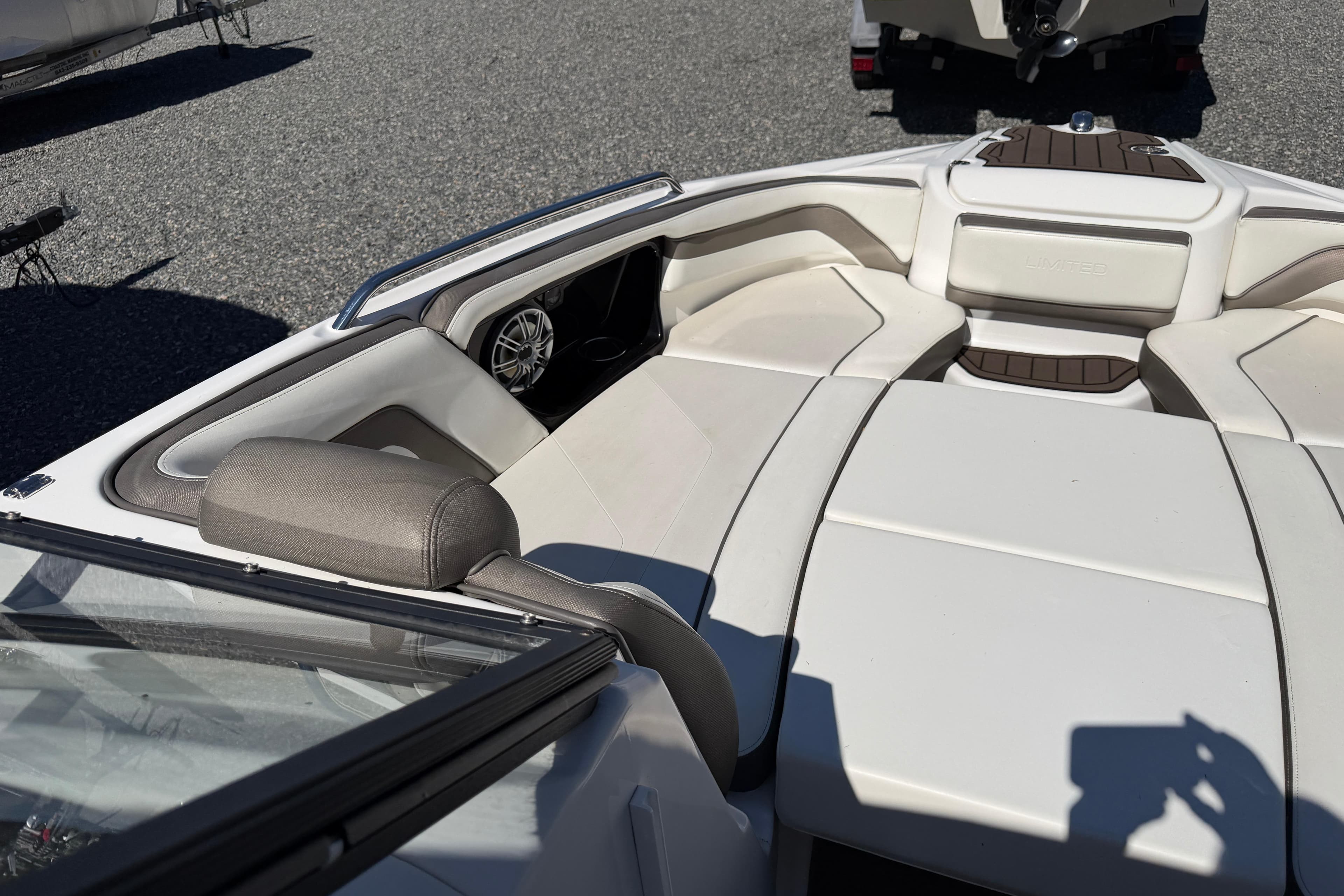 2016 Yamaha Boats 242 Limited S interior with white seating and speaker detail.