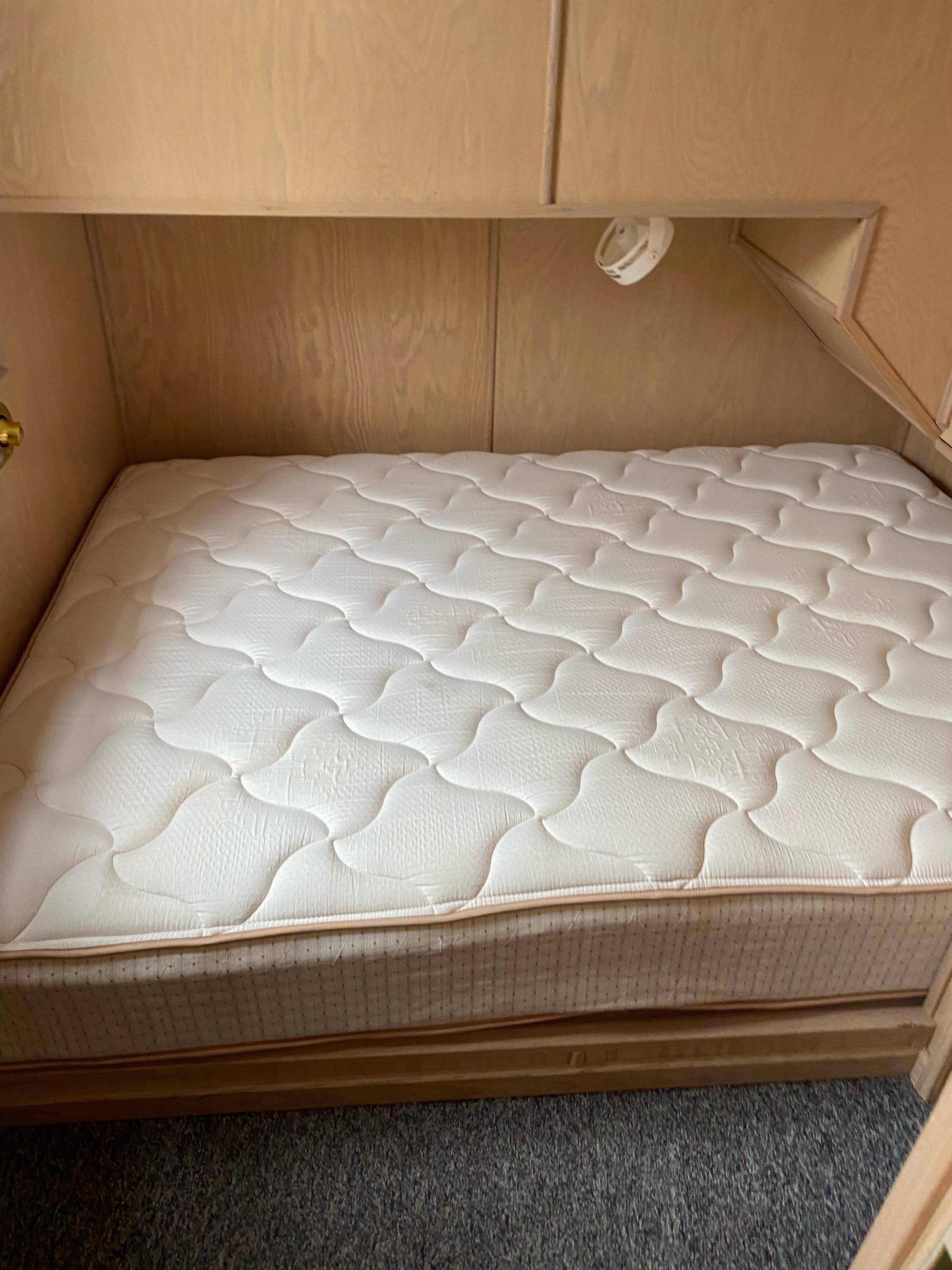 Boat interior with a comfortable mattress, Stardust Cruisers Summer Dreamin' Trip 37 and 38, 2001 model.