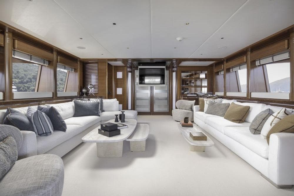 Luxurious interior of 2009 CRN 129 yacht with elegant seating and modern decor.