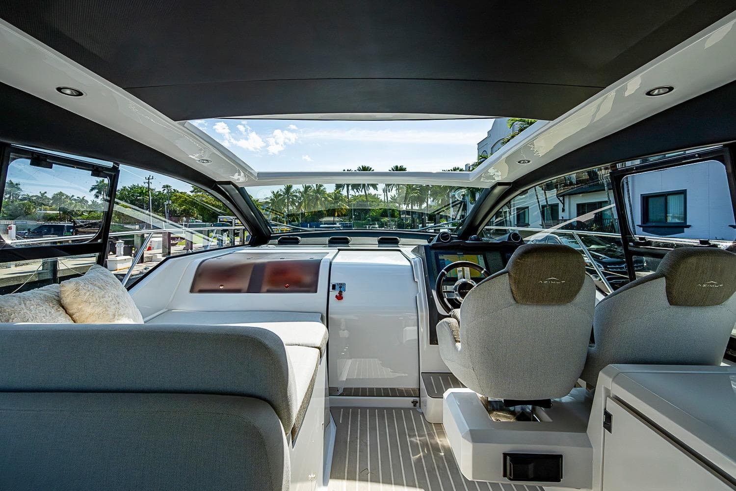 Interior view of 2019 Azimut Atlantis 51 yacht cockpit with modern seating and controls.