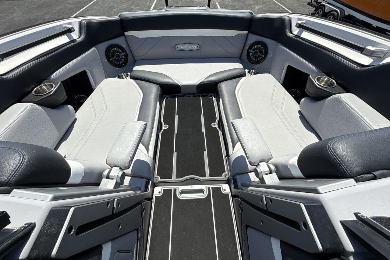 Interior of 2023 Supra SE 550 boat with luxurious seating and modern design.