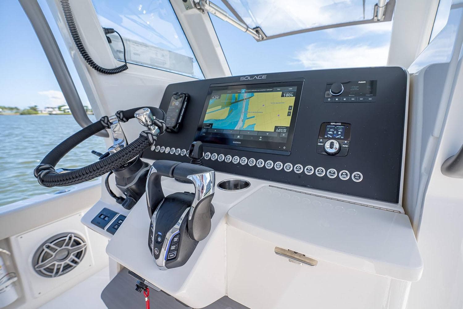 Manufacturer Provided Image: Helm of 2026 Solace 28 HCS boat with advanced navigation system and controls.