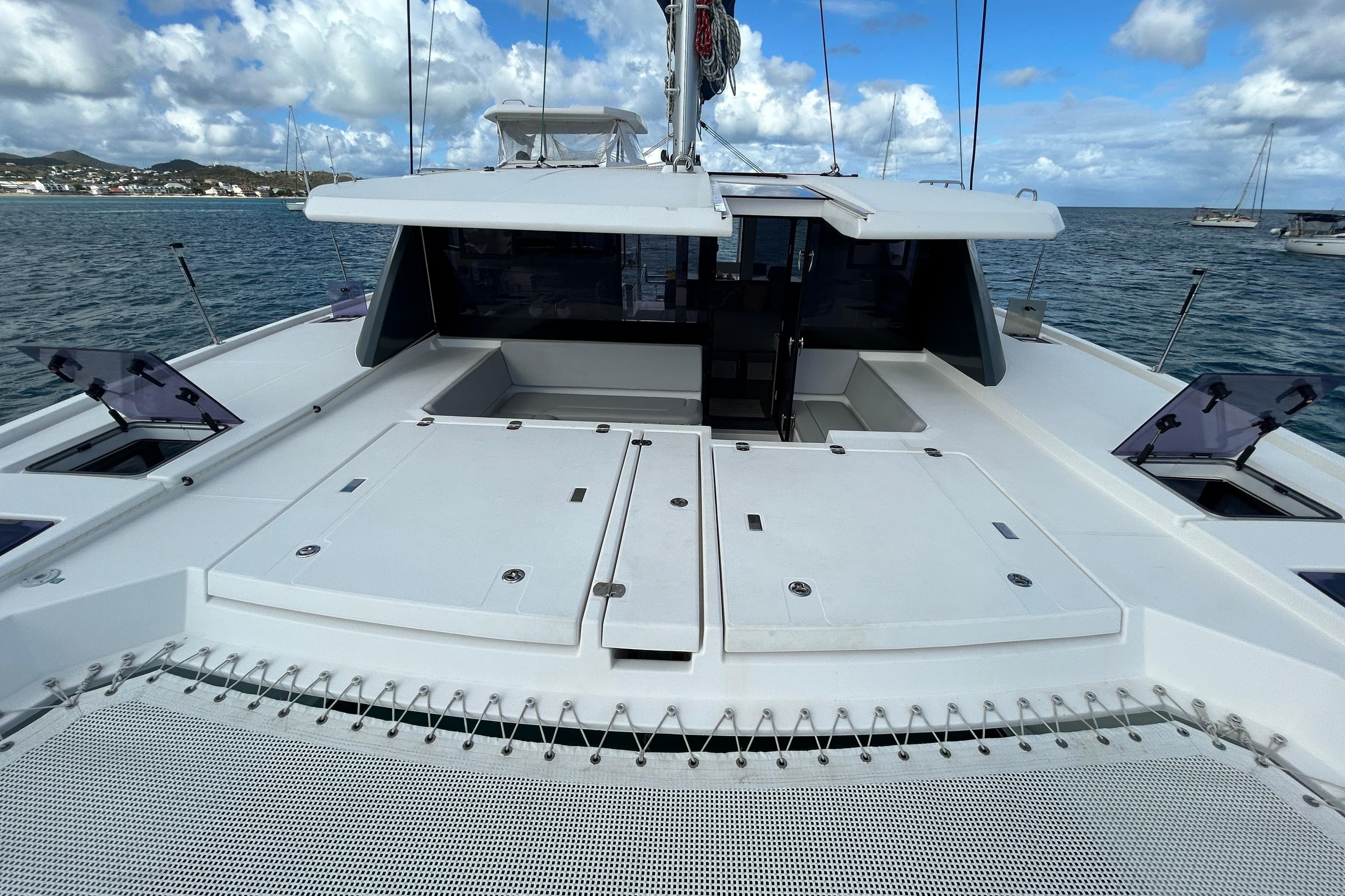 2020 Leopard 45 catamaran deck with open hatches, sailing on a sunny day.