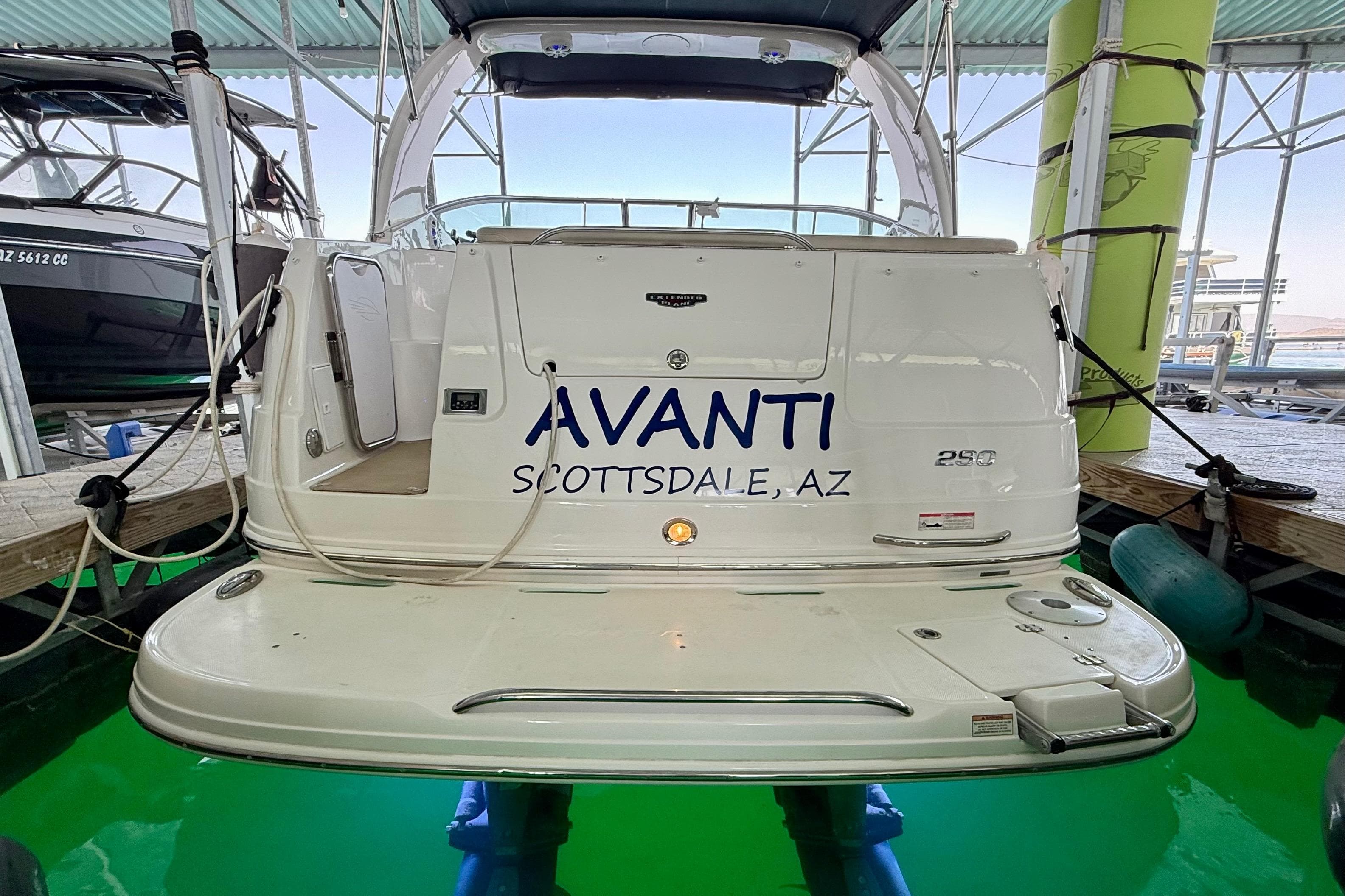 2016 Chaparral 290 Signature boat docked, rear view with "Avanti" and "Scottsdale, AZ" text.