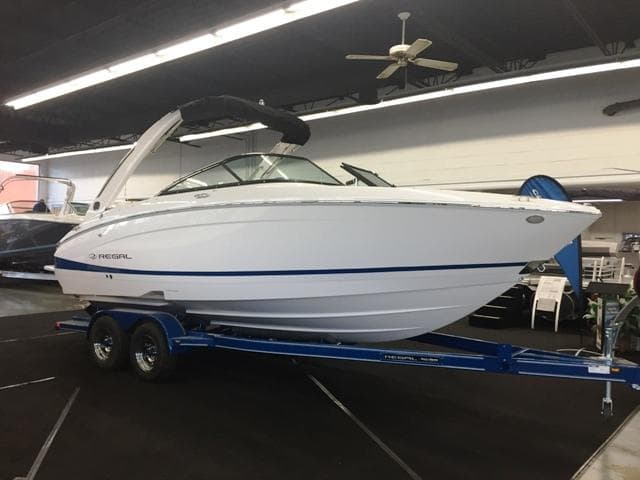 2020 Regal LS4 boat on trailer in showroom.