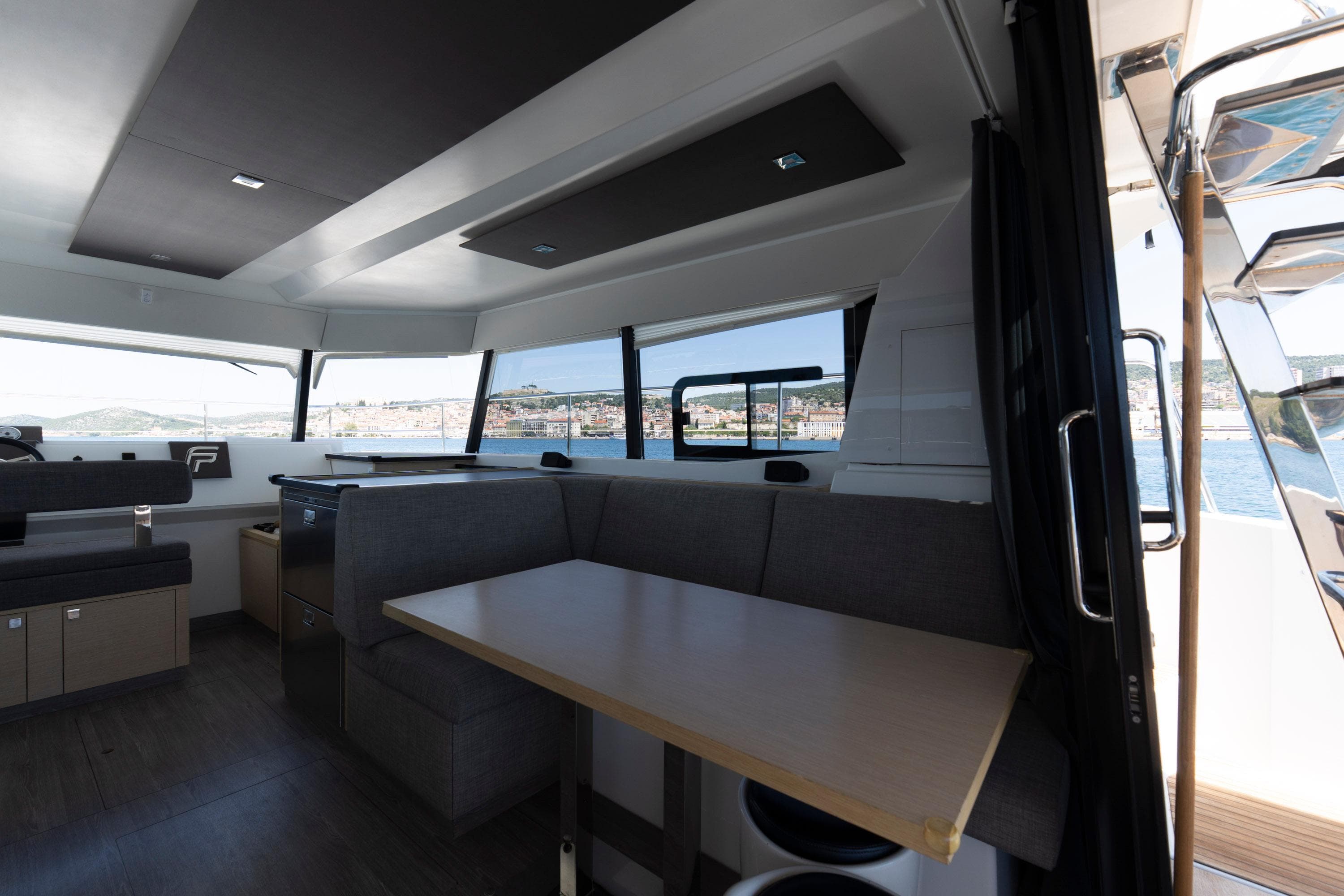 Interior of 2019 Fountaine Pajot MY 37 yacht with modern seating and dining area.