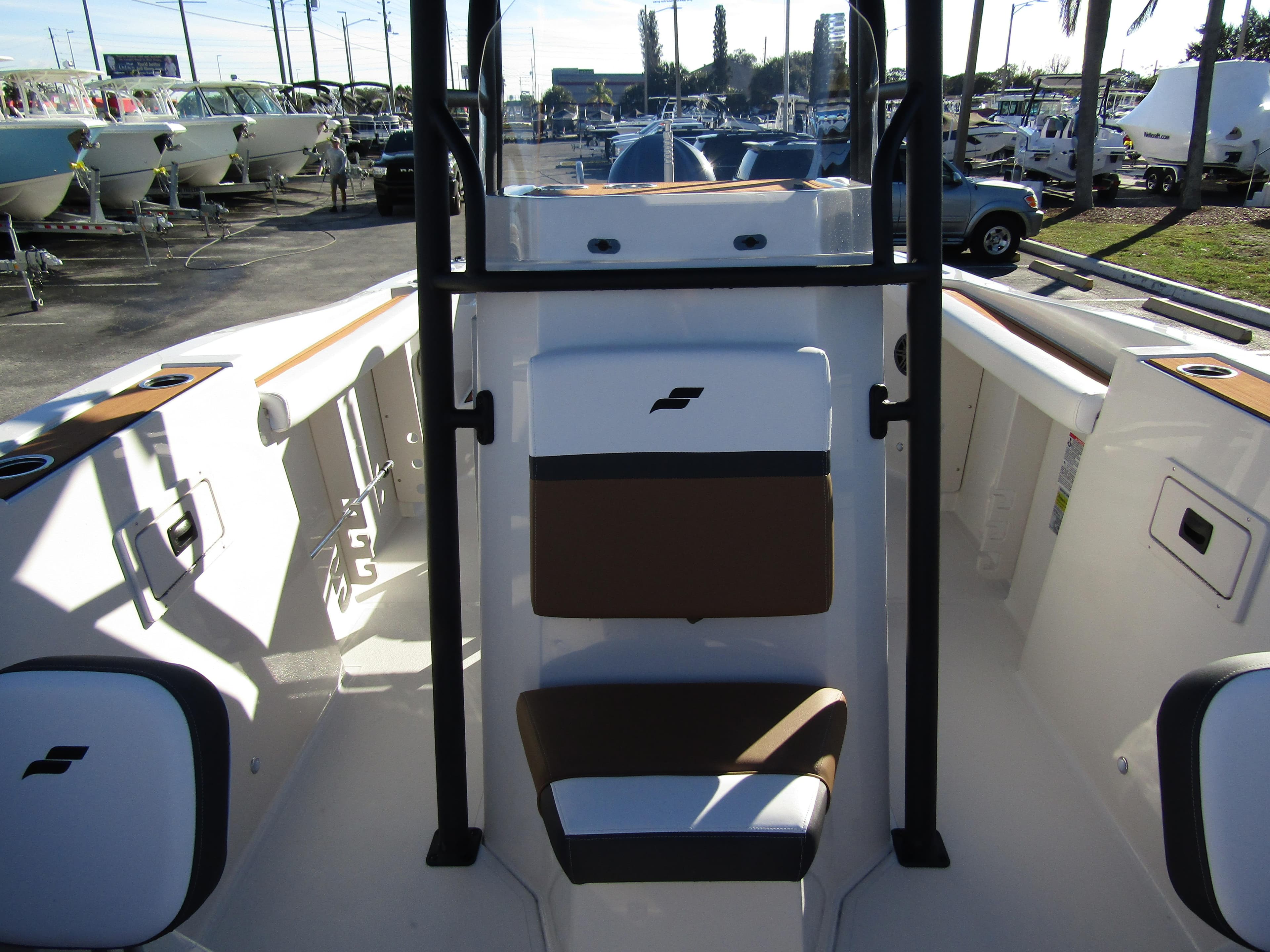 2024 Starcraft SVX 231 OB CC boat interior with seating and storage compartments.