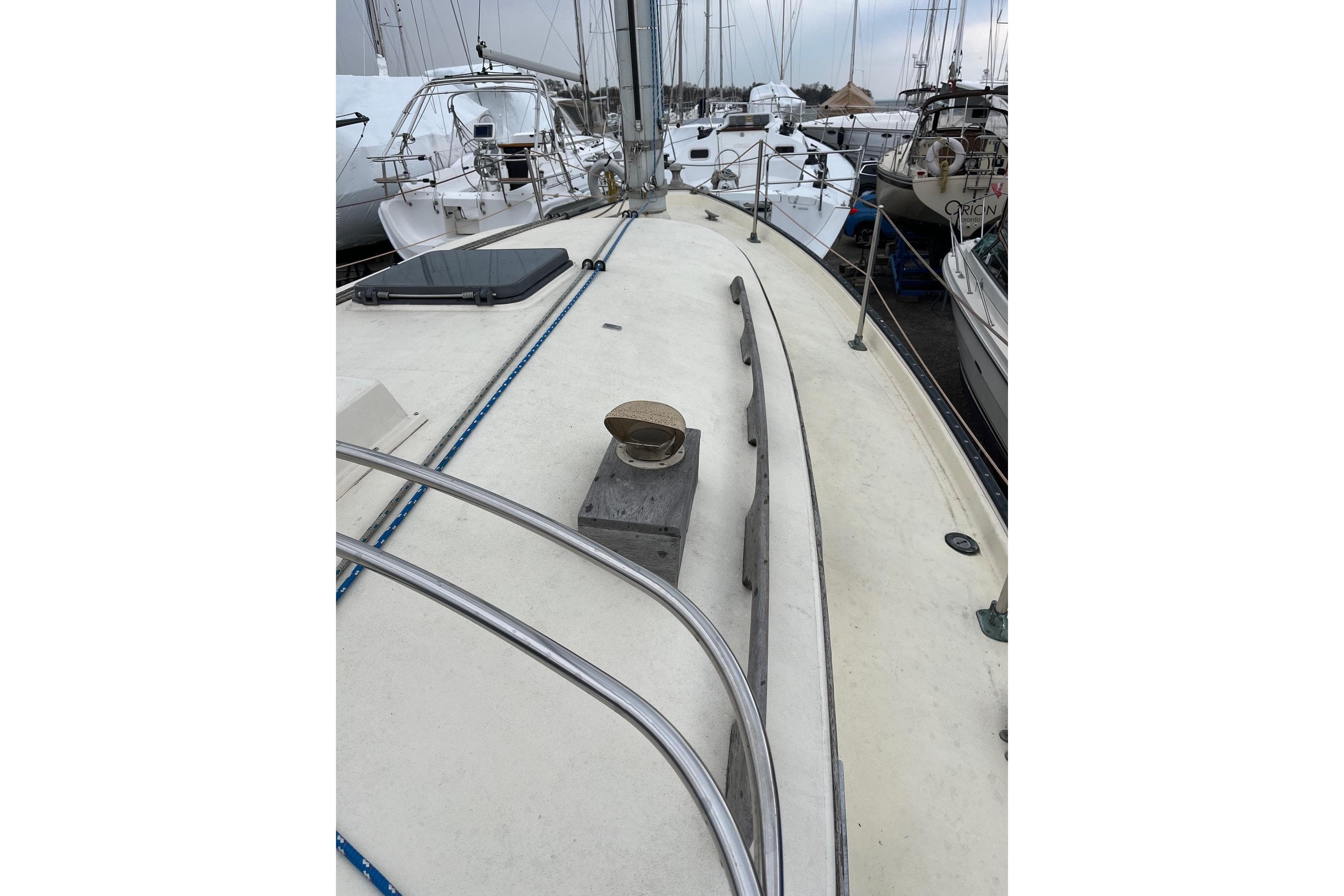 1980 Hinterhoeller Nonsuch 30 Classic sailboat deck view in marina setting.