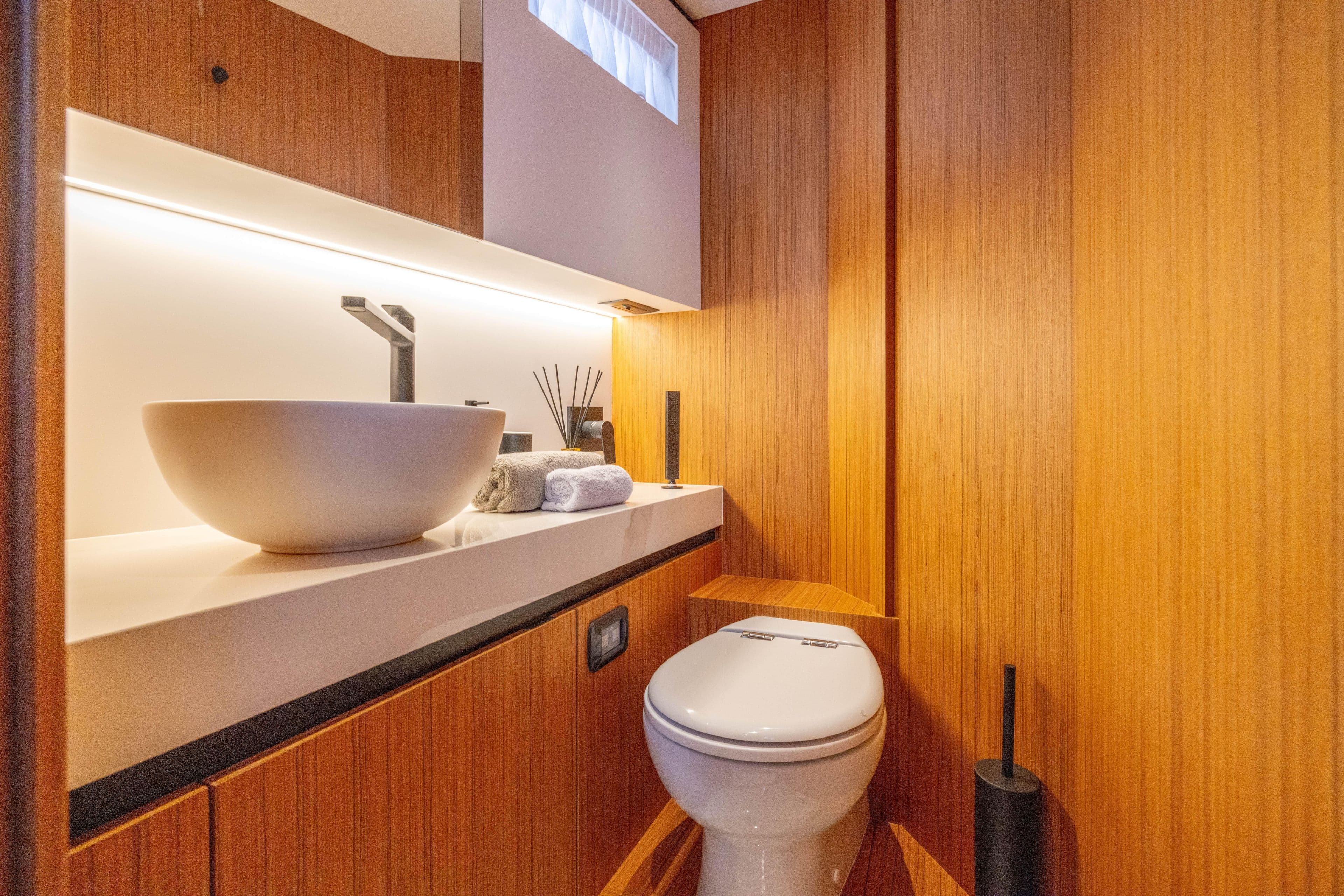 Luxurious bathroom in 2025 Solaris Power 60 Open yacht with modern fixtures and wooden accents.