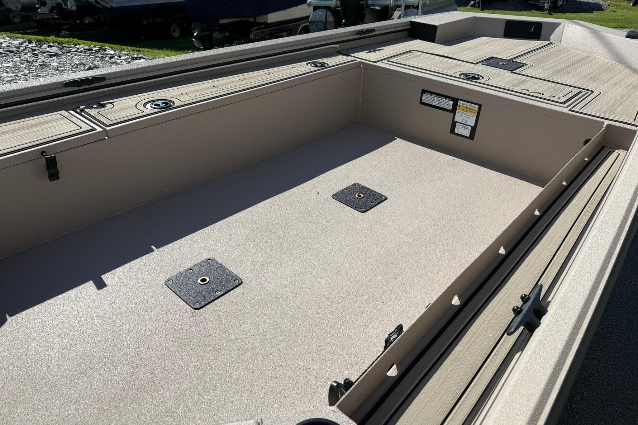 Interior view of a 2026 Avid 16 Commander boat, showcasing spacious deck layout.