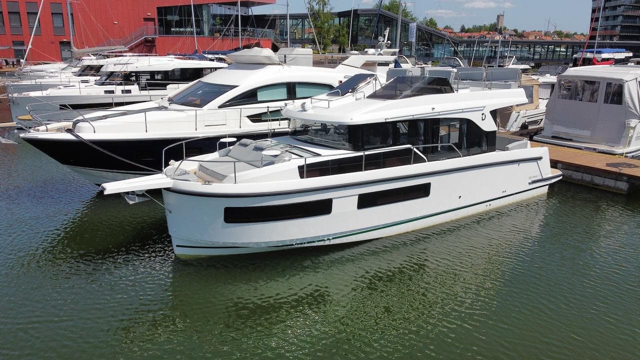 2023 Delphia 11 Flylounge yacht docked in a marina.