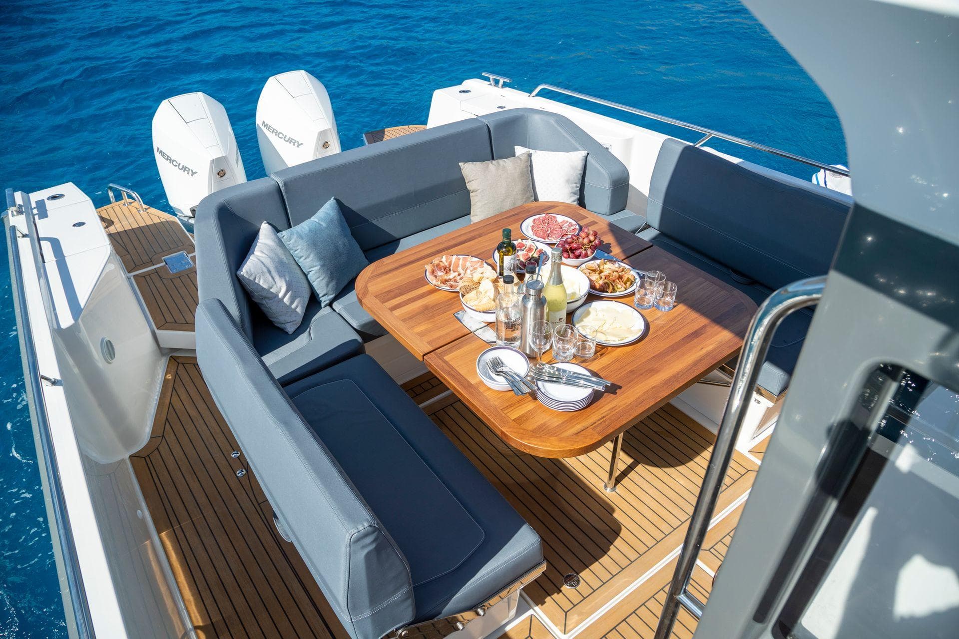 Luxurious 2024 Nimbus Tender 11 yacht with elegant dining setup on deck.
