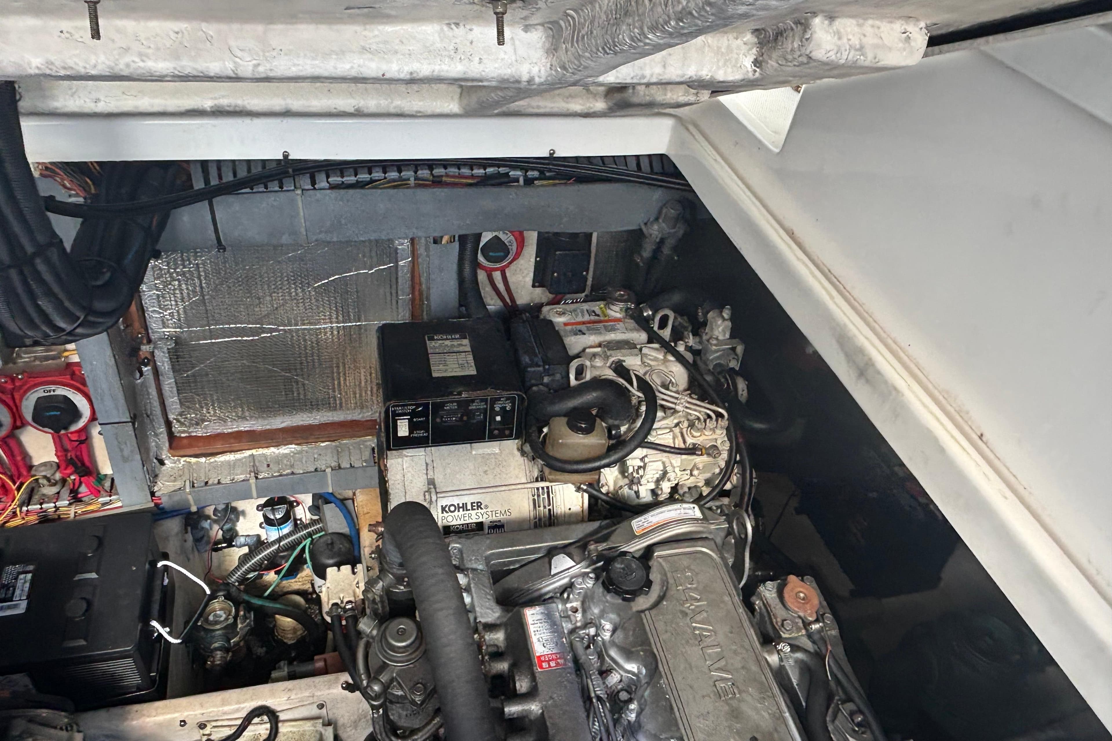 Engine compartment of a 2004 Luhrs 32 Open boat, featuring Kohler power systems.