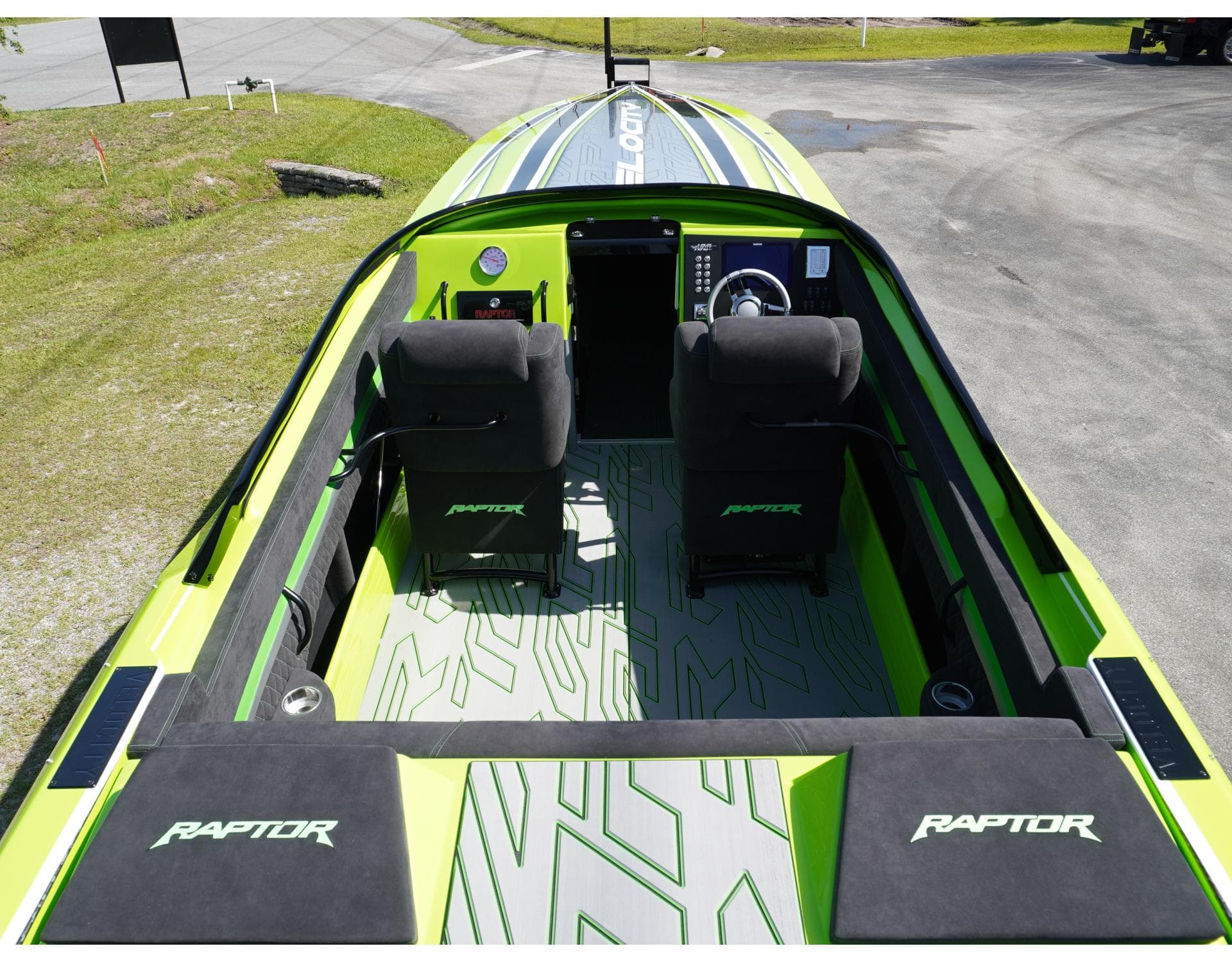 2025 Velocity 40 RAPTOR boat interior with green accents and dual seating.