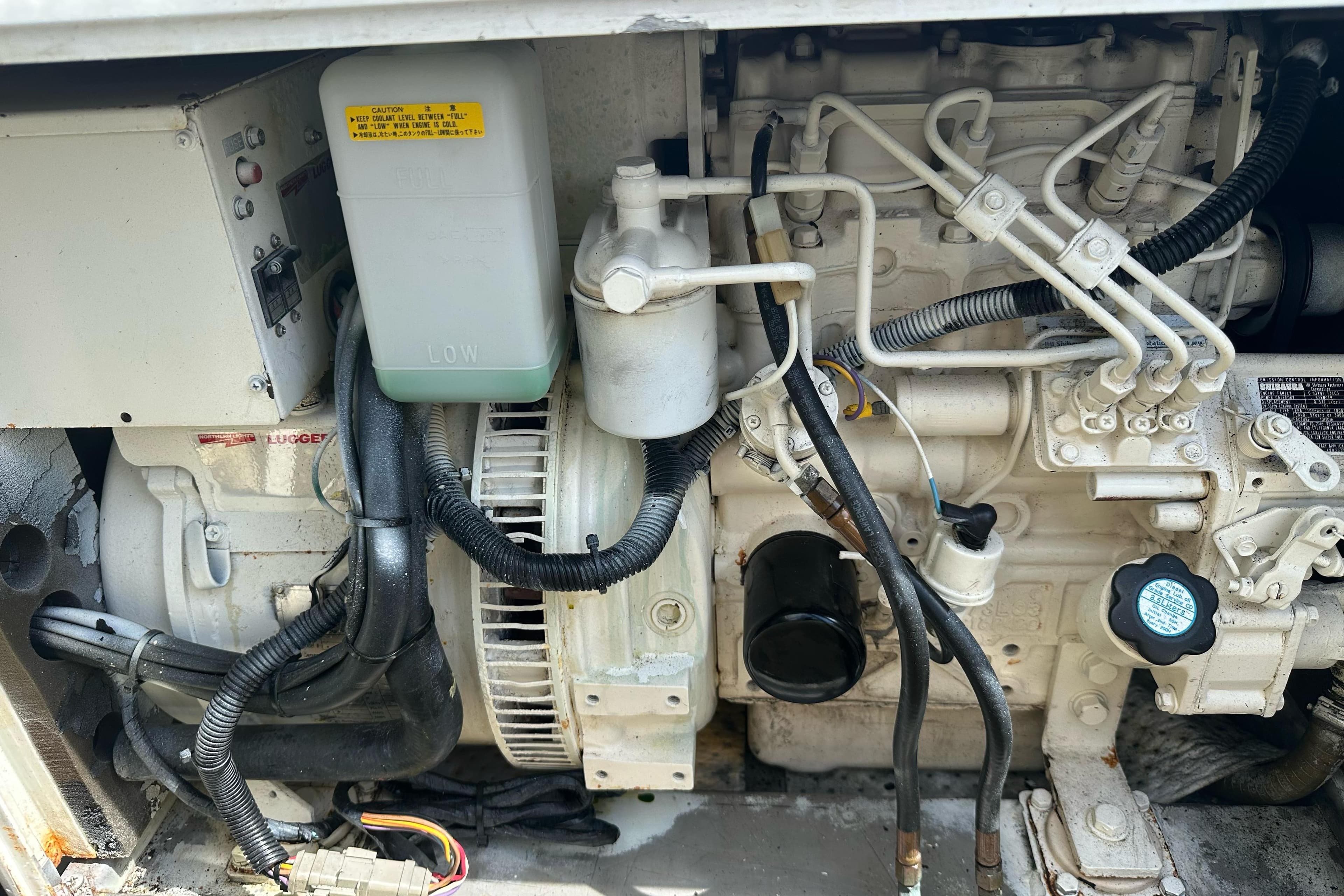 Engine compartment of a 2018 Leopard 45, showcasing mechanical components and wiring.