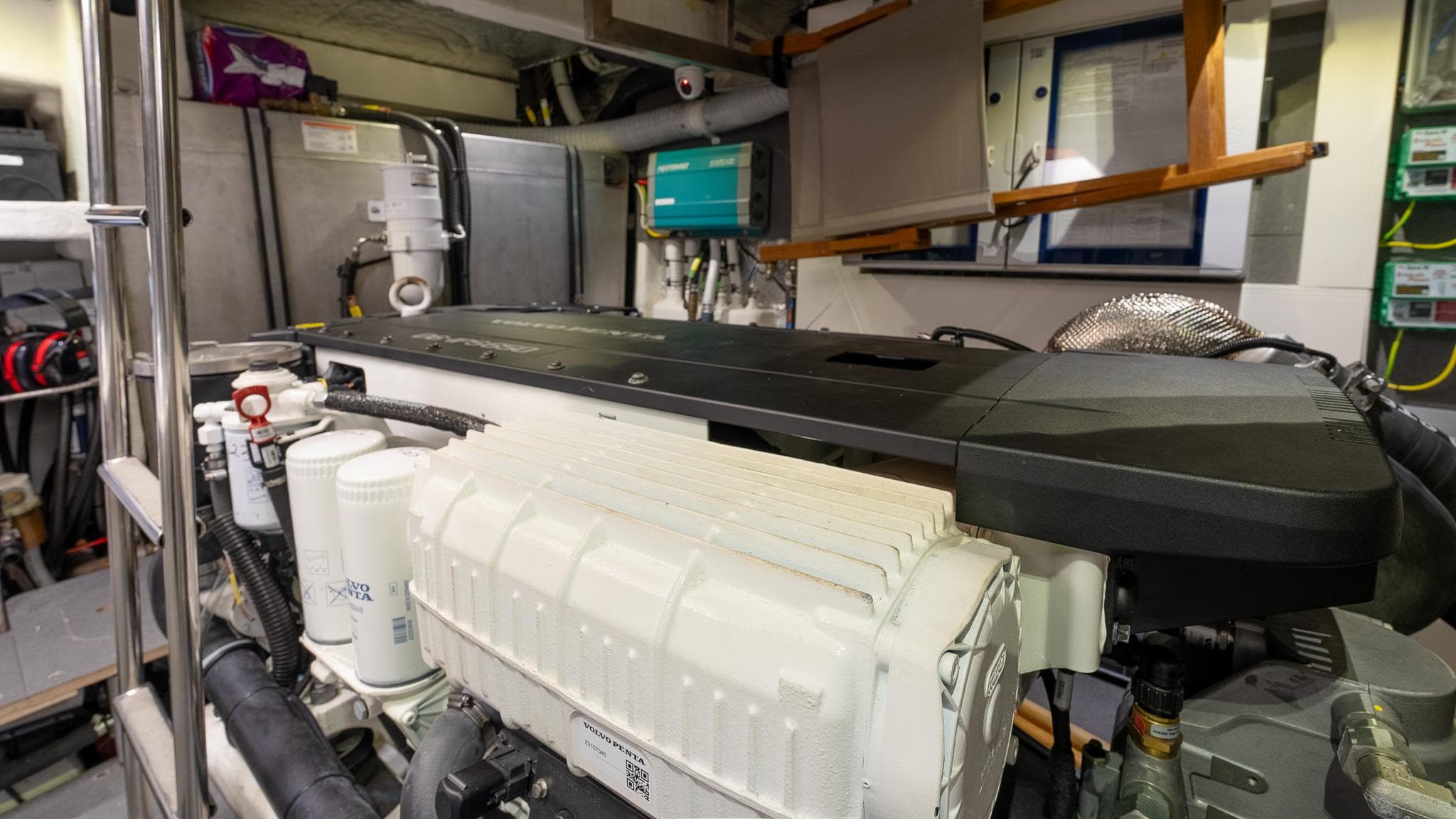 Engine room of 2023 Absolute 52 Navetta yacht, showcasing advanced machinery and equipment.