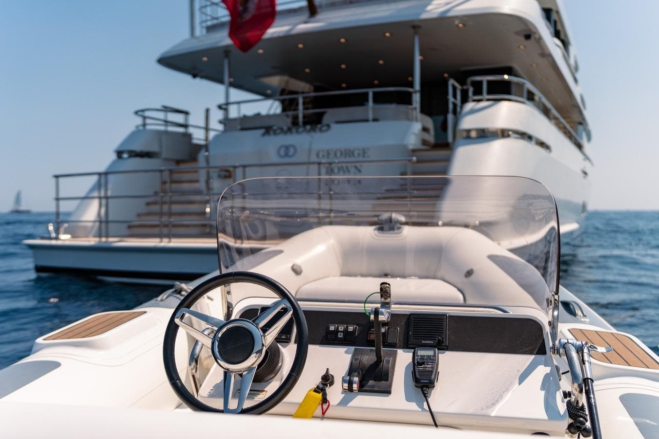 Luxury yacht Moonen Martinique YN1, 2020, with tender steering wheel in foreground.