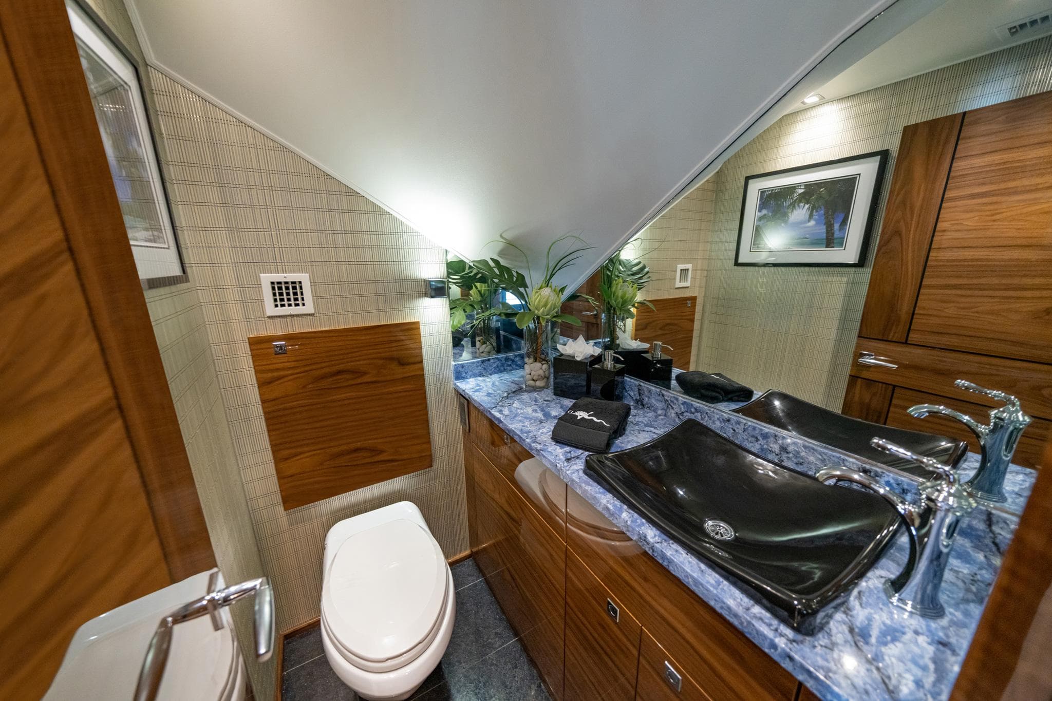 Luxurious bathroom in 2025 Viking 90 Convertible yacht with modern fixtures and elegant design.