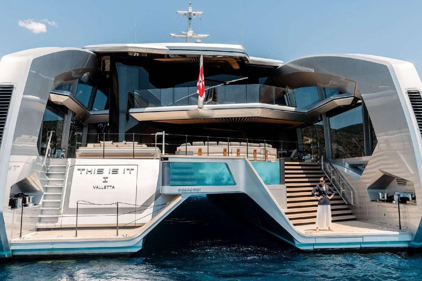 Luxury Tecnomar Catamaran 44, 2024 model, docked with modern design and spacious deck.