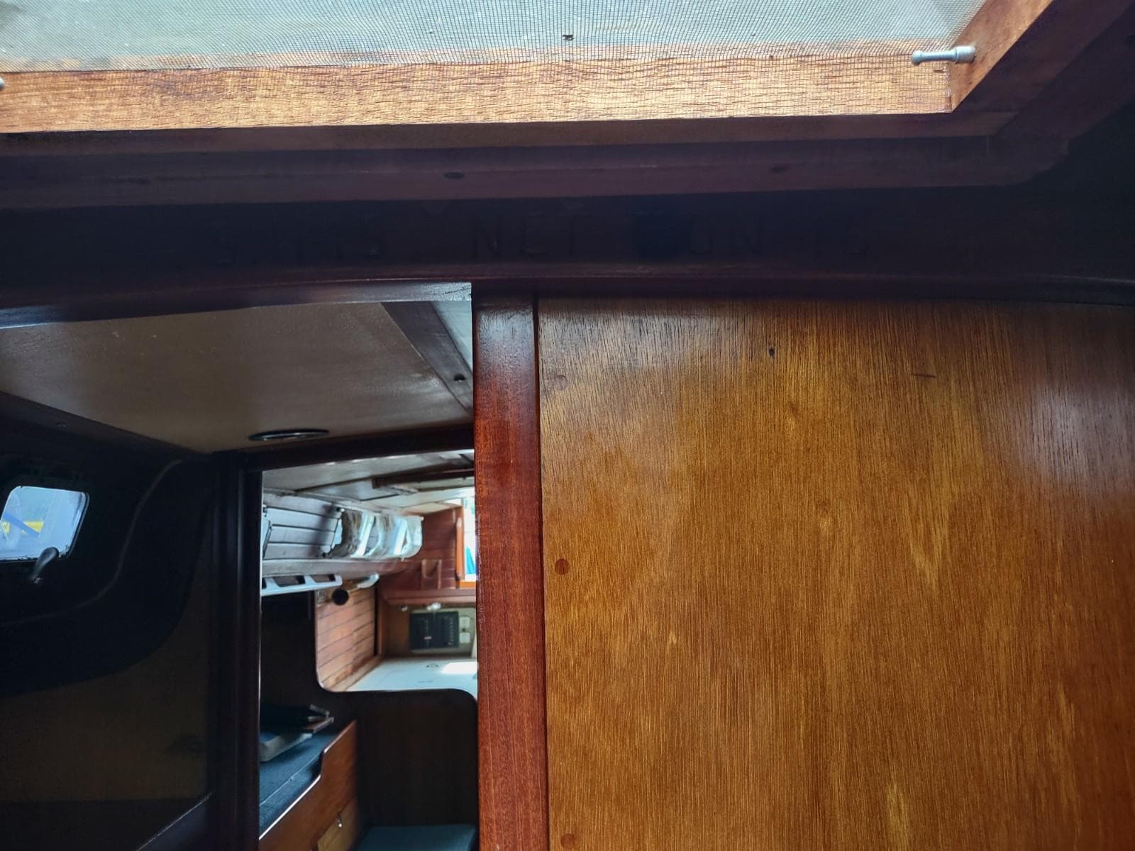 Interior view of 1968 Owens Borsaw 40 boat, showcasing wooden paneling and cabin details.