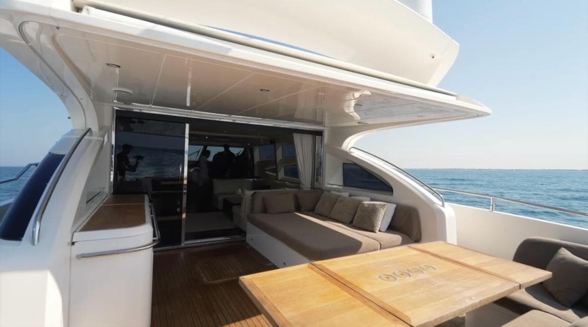 Luxurious 2011 Princess V78 yacht deck with seating and ocean view.