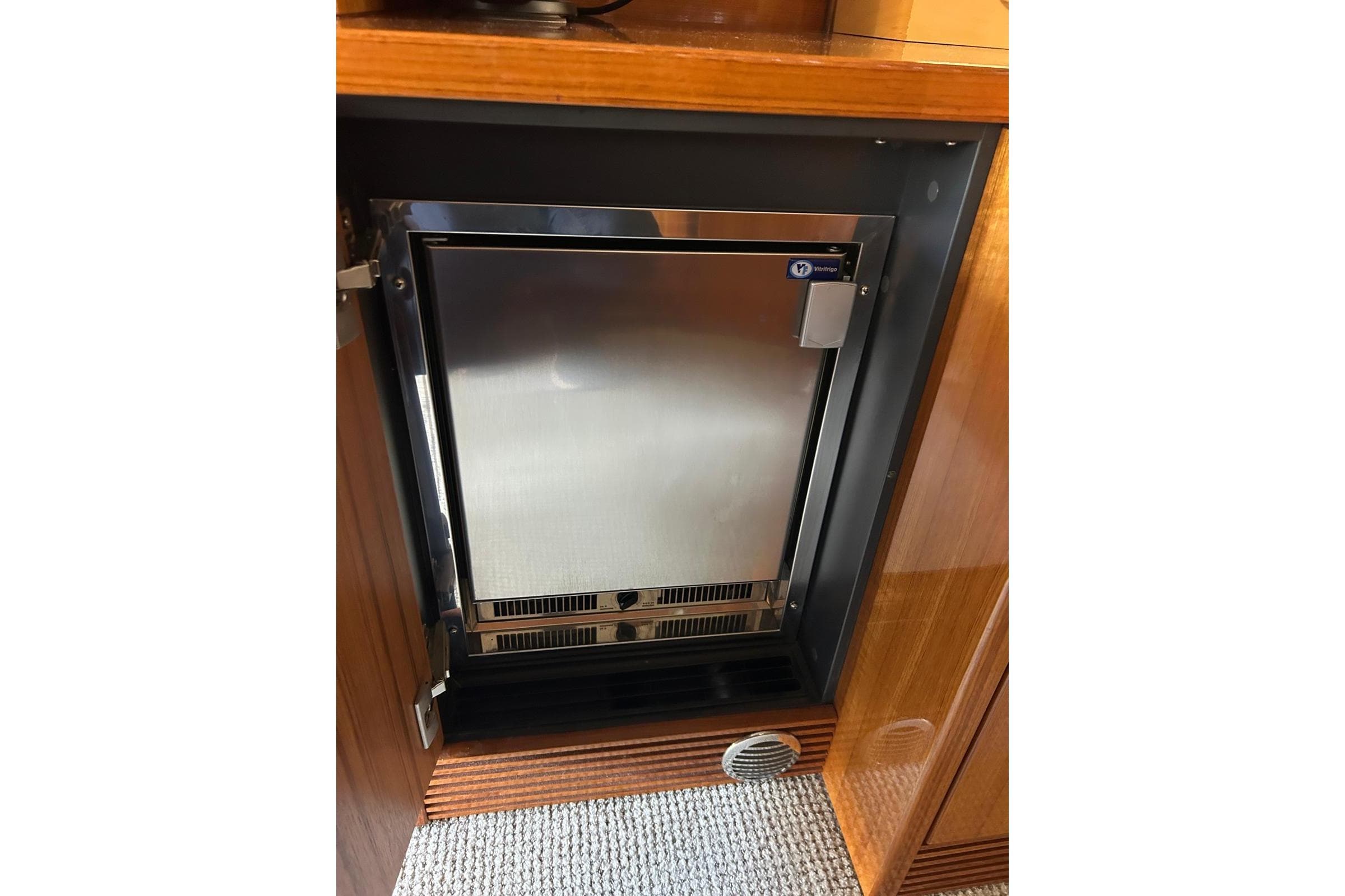 Stainless steel refrigerator in 2015 Maritimo S62 yacht interior.