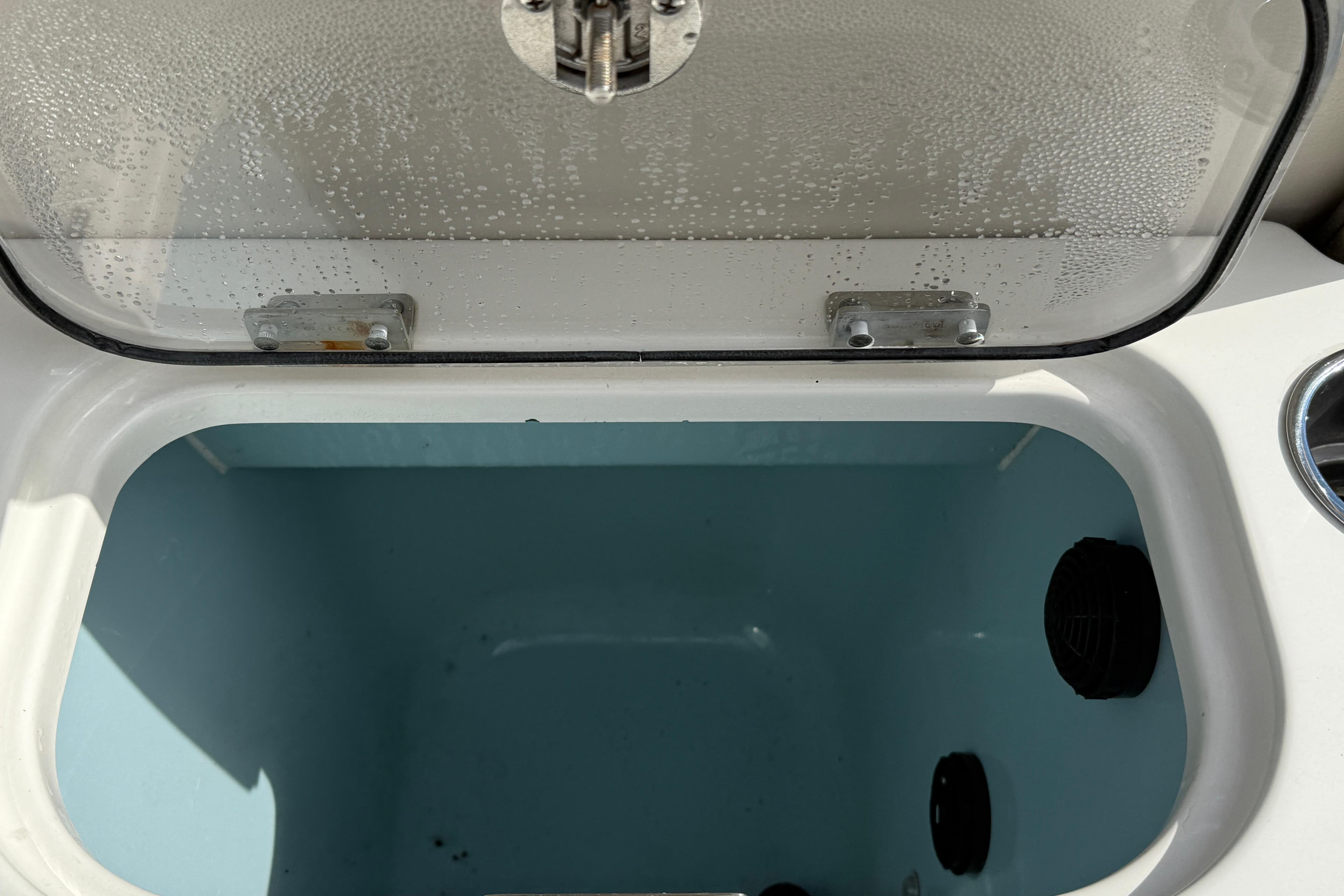 Open storage compartment on 2018 Boston Whaler 270 Dauntless boat.