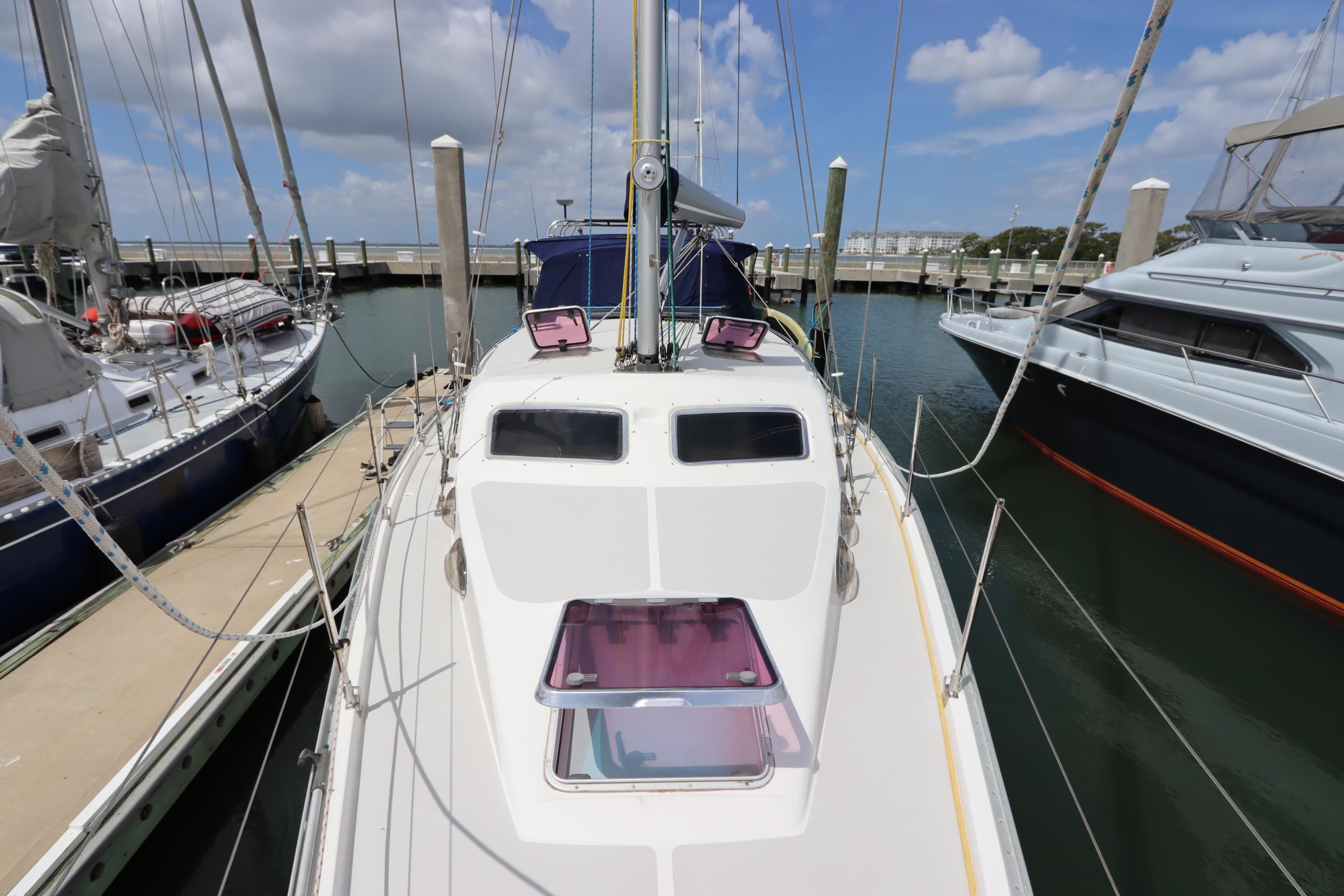 Catalina Morgan 440 sailboat docked at marina, 2007 model, under clear blue sky.