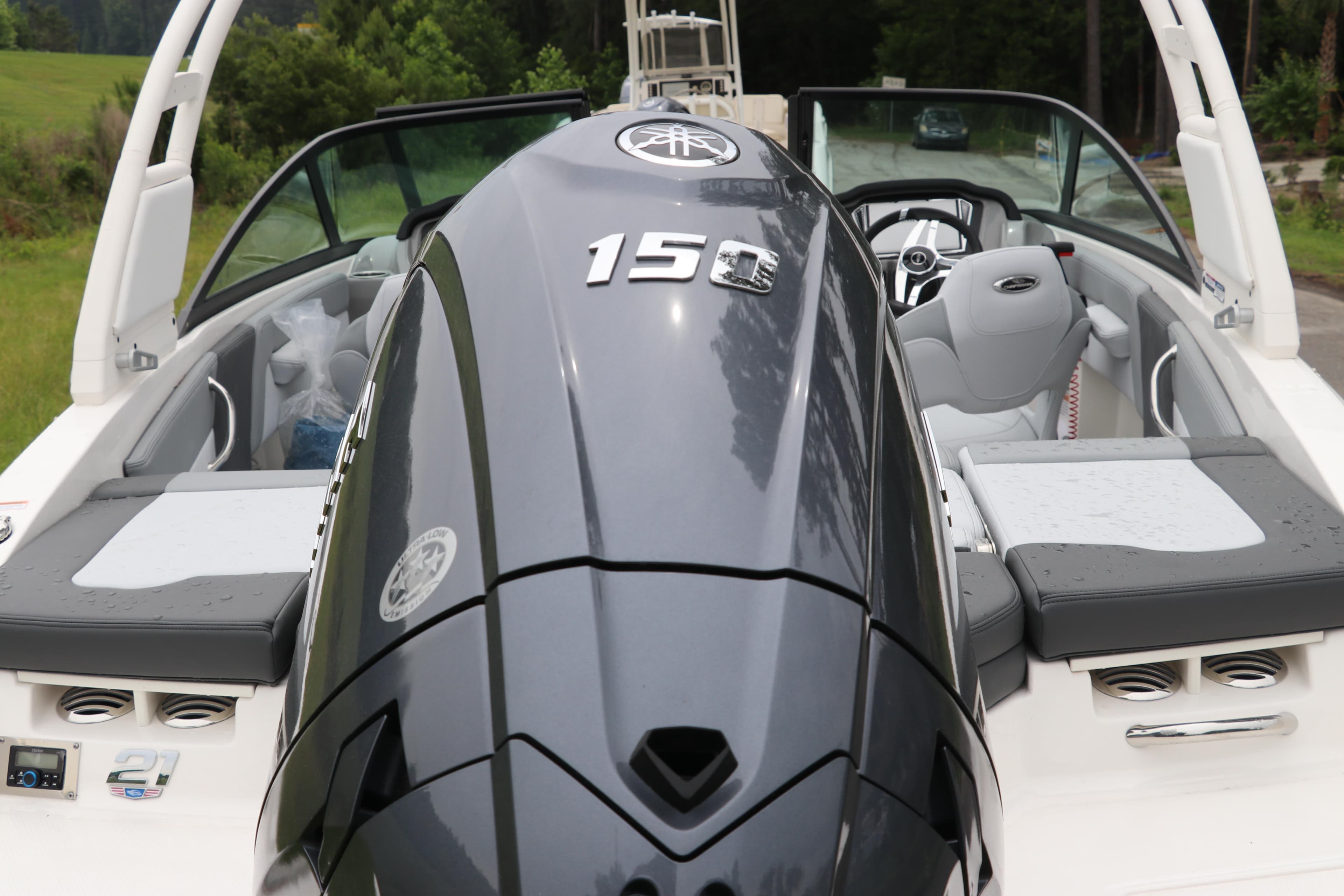 2026 Chaparral 21 SSi OB boat with powerful outboard motor, sleek design, and comfortable seating.
