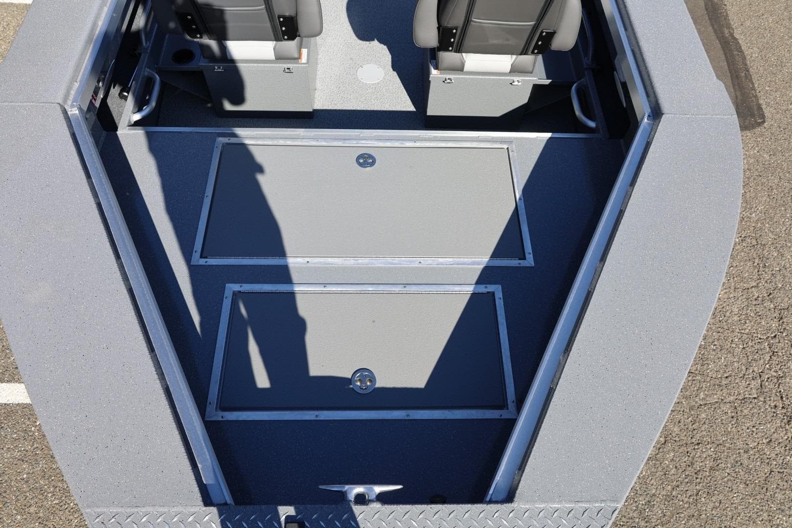 Interior view of 2026 Thunder Jet 229 Rush OT boat, featuring storage compartments and seating.