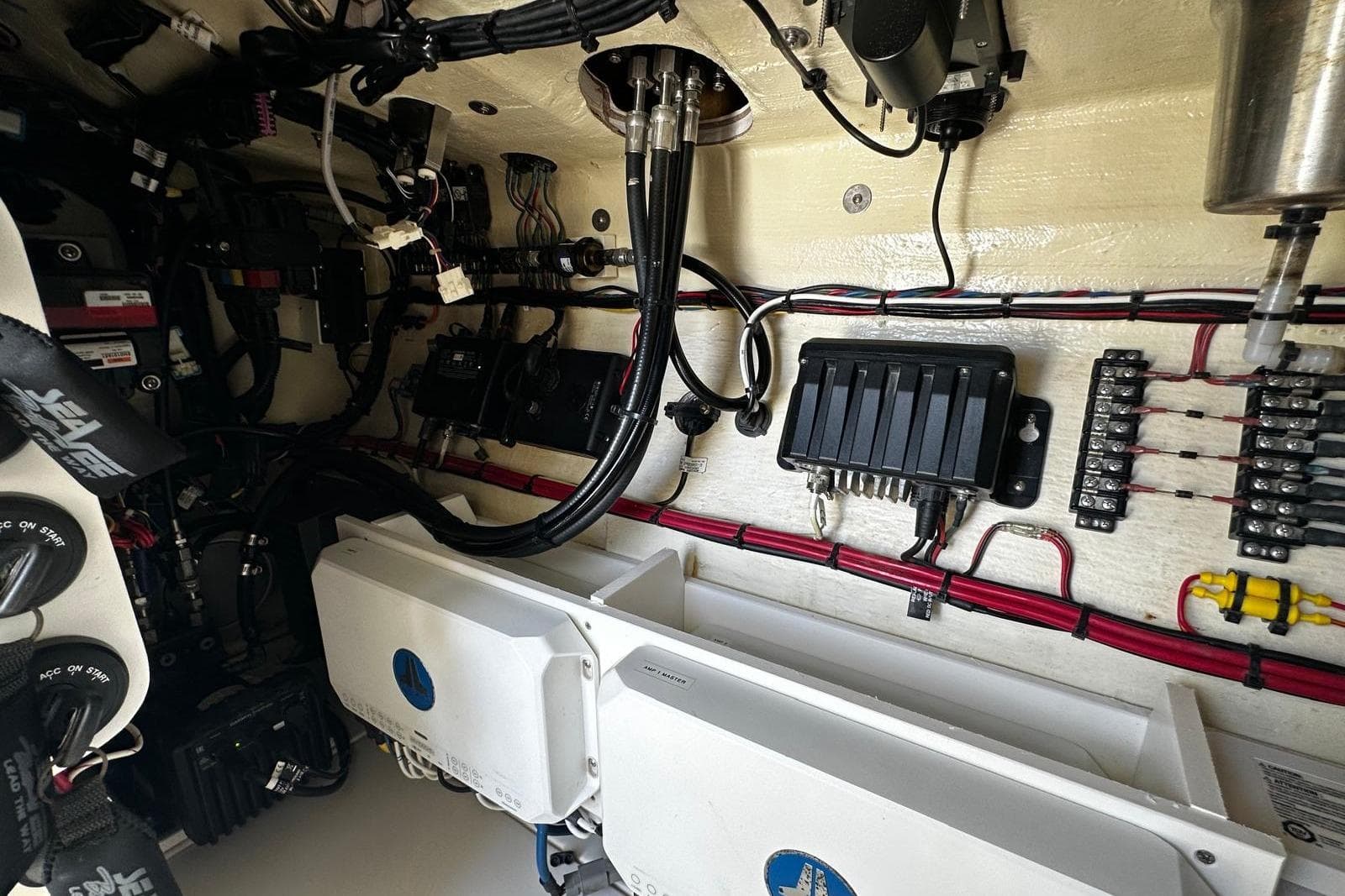 Engine room of 2022 SeaVee 390Z boat, showcasing wiring and electrical components.