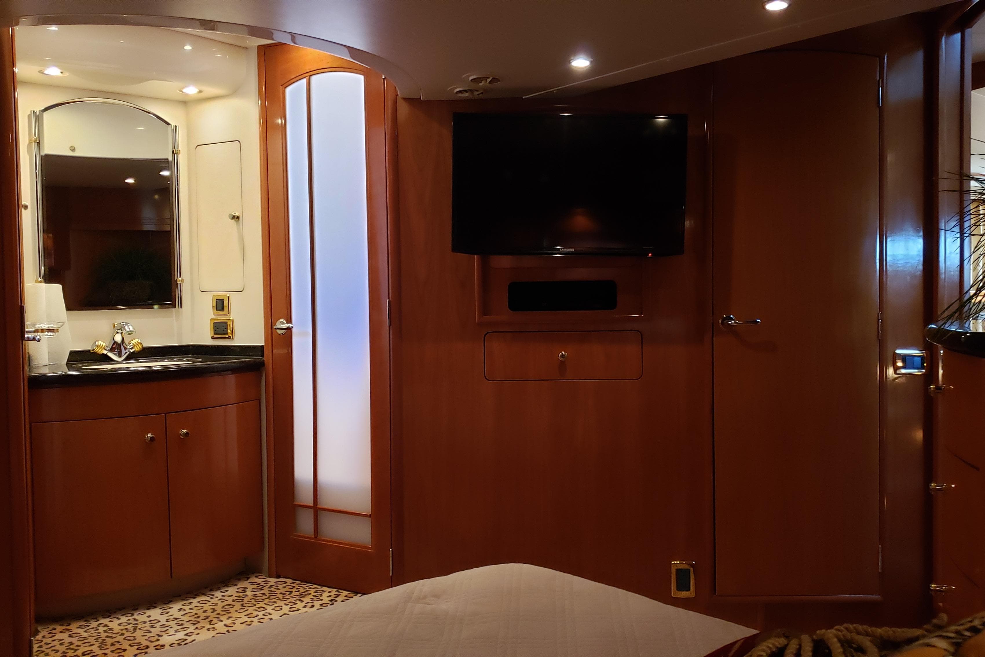 Luxurious interior of 2002 Carver 570 Voyager Pilothouse with wood paneling and modern amenities.