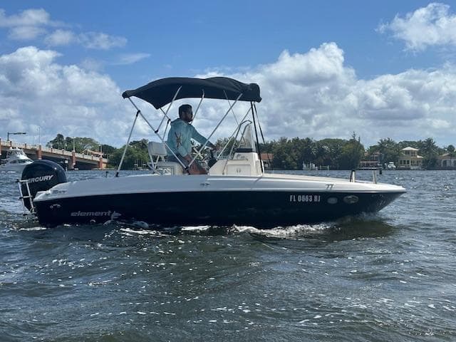 2016 Bayliner F18 Element boat cruising on a sunny day.