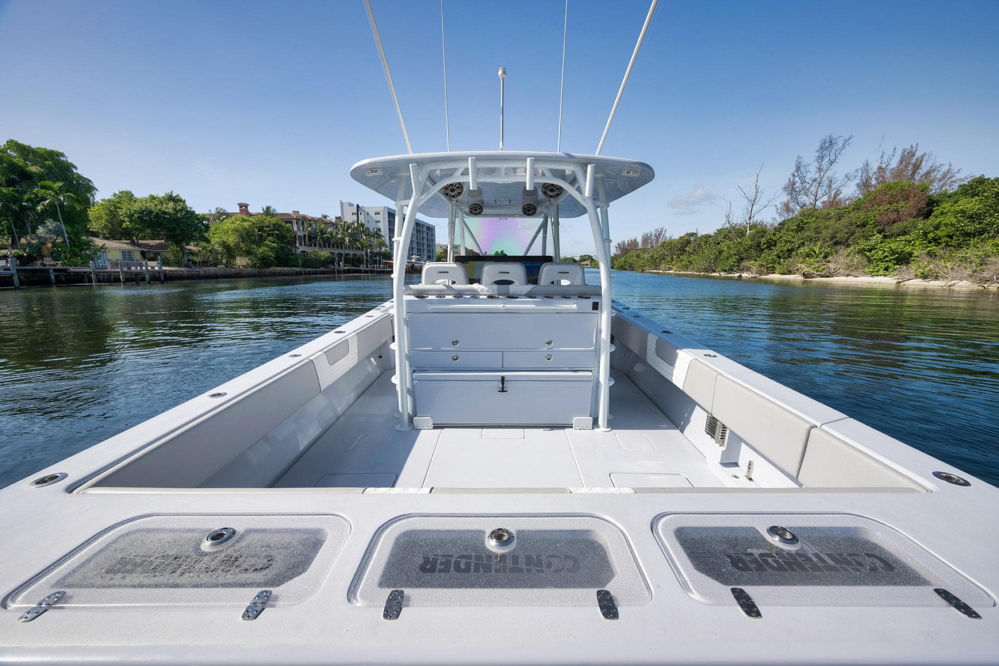 2025 Contender 44 ST boat on calm water, showcasing spacious deck and sleek design.