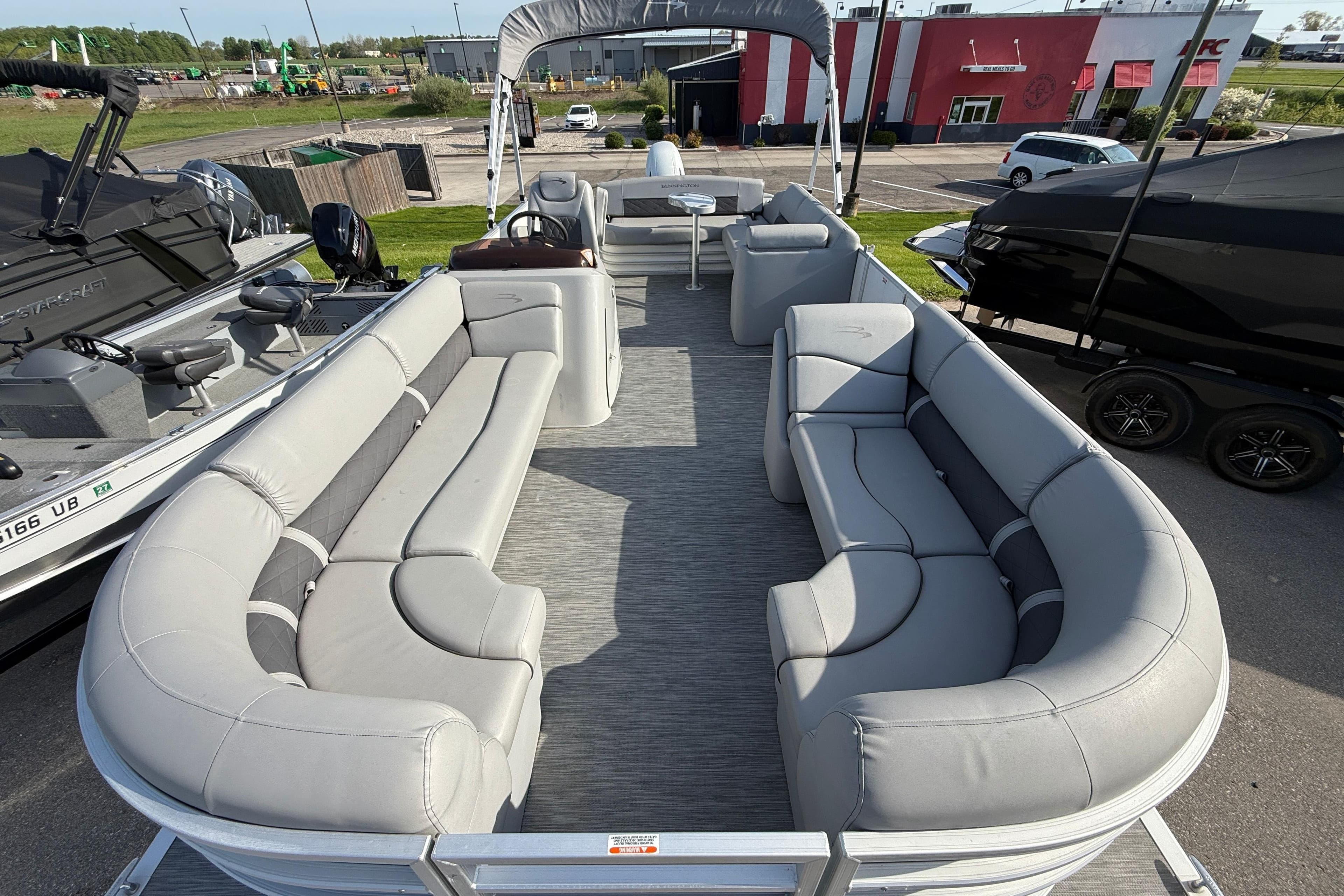 2021 Bennington 25 SSBXSD pontoon boat with spacious seating and modern design.