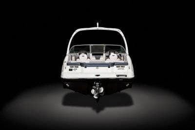 2025 Chaparral 23 SSI SPORT boat, rear view, on a dark background.