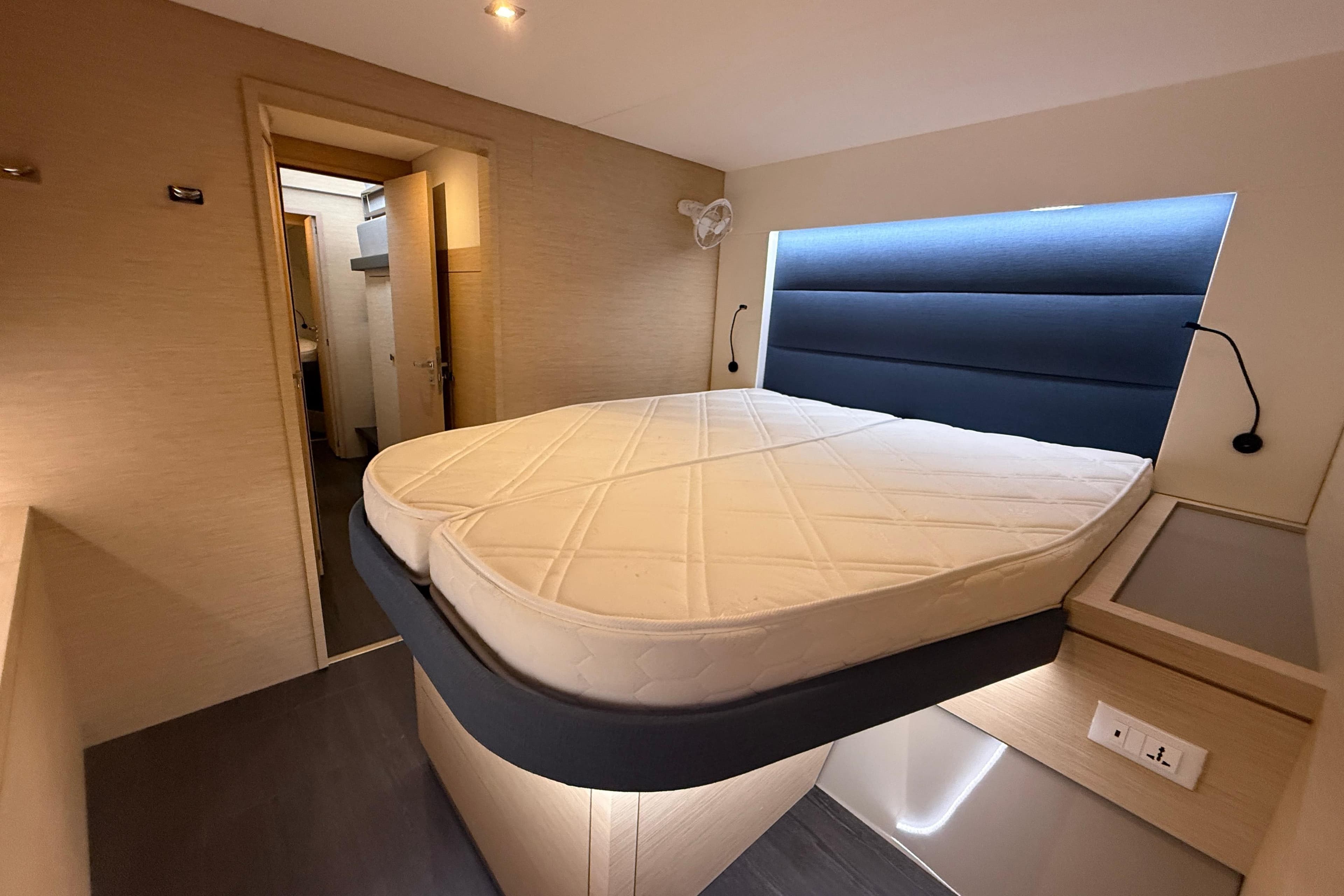 Luxurious cabin interior of 2025 Fountaine Pajot Tanna 47 yacht with modern bed design.