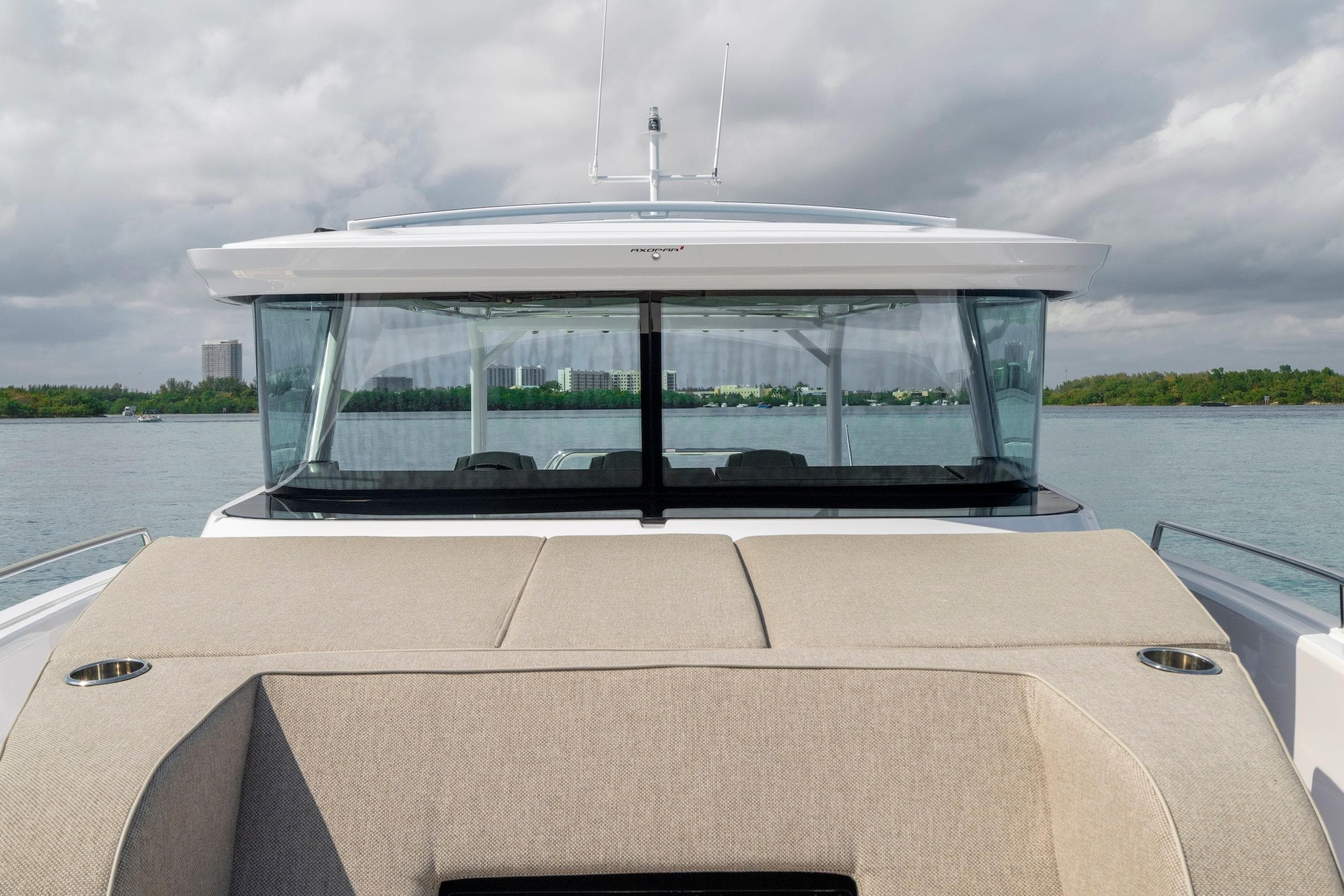 2025 Axopar 45 Cross Top boat on water, featuring sleek design and modern amenities.