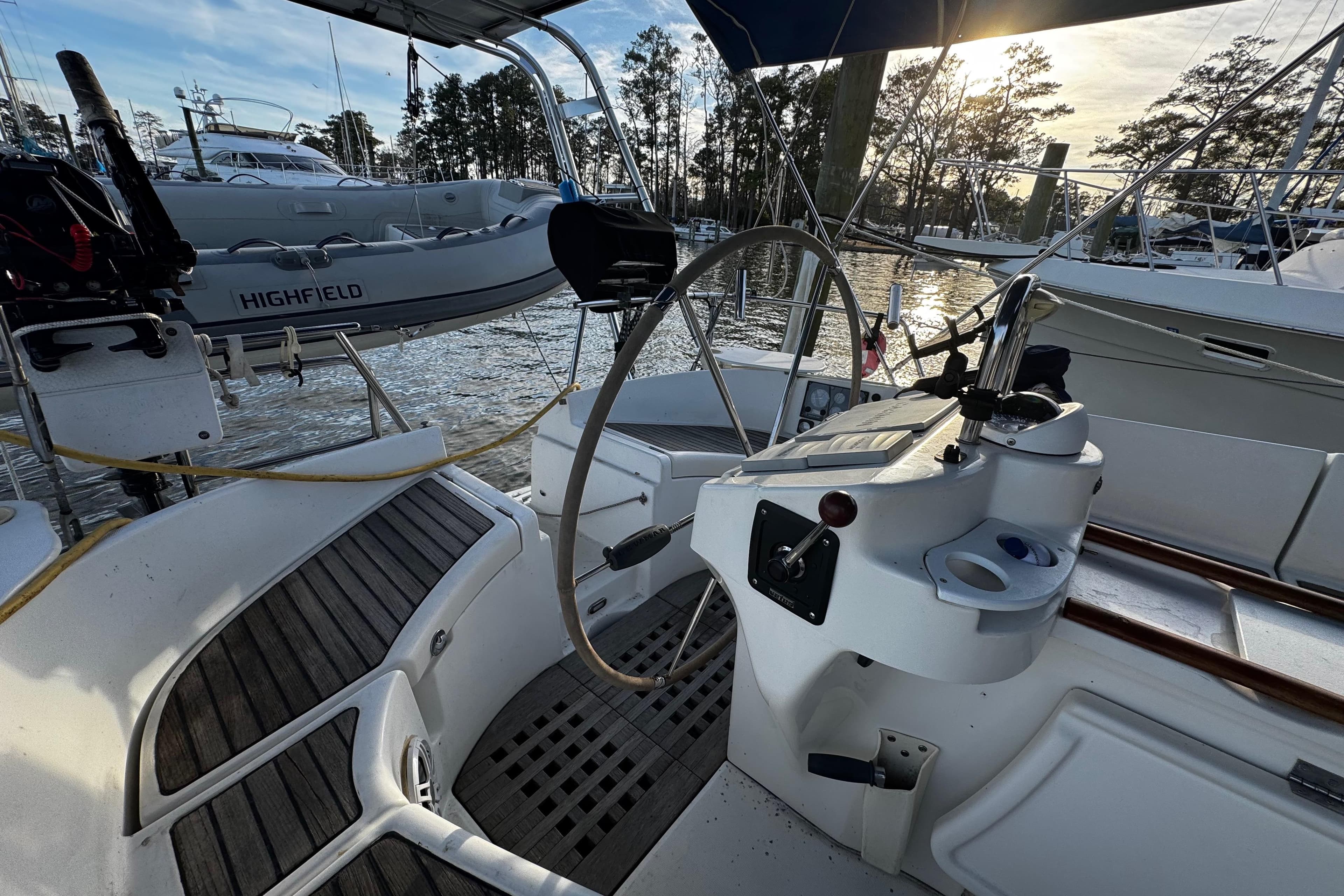 Cockpit view of 1999 Beneteau Oceanis Clipper 461 sailboat at marina.