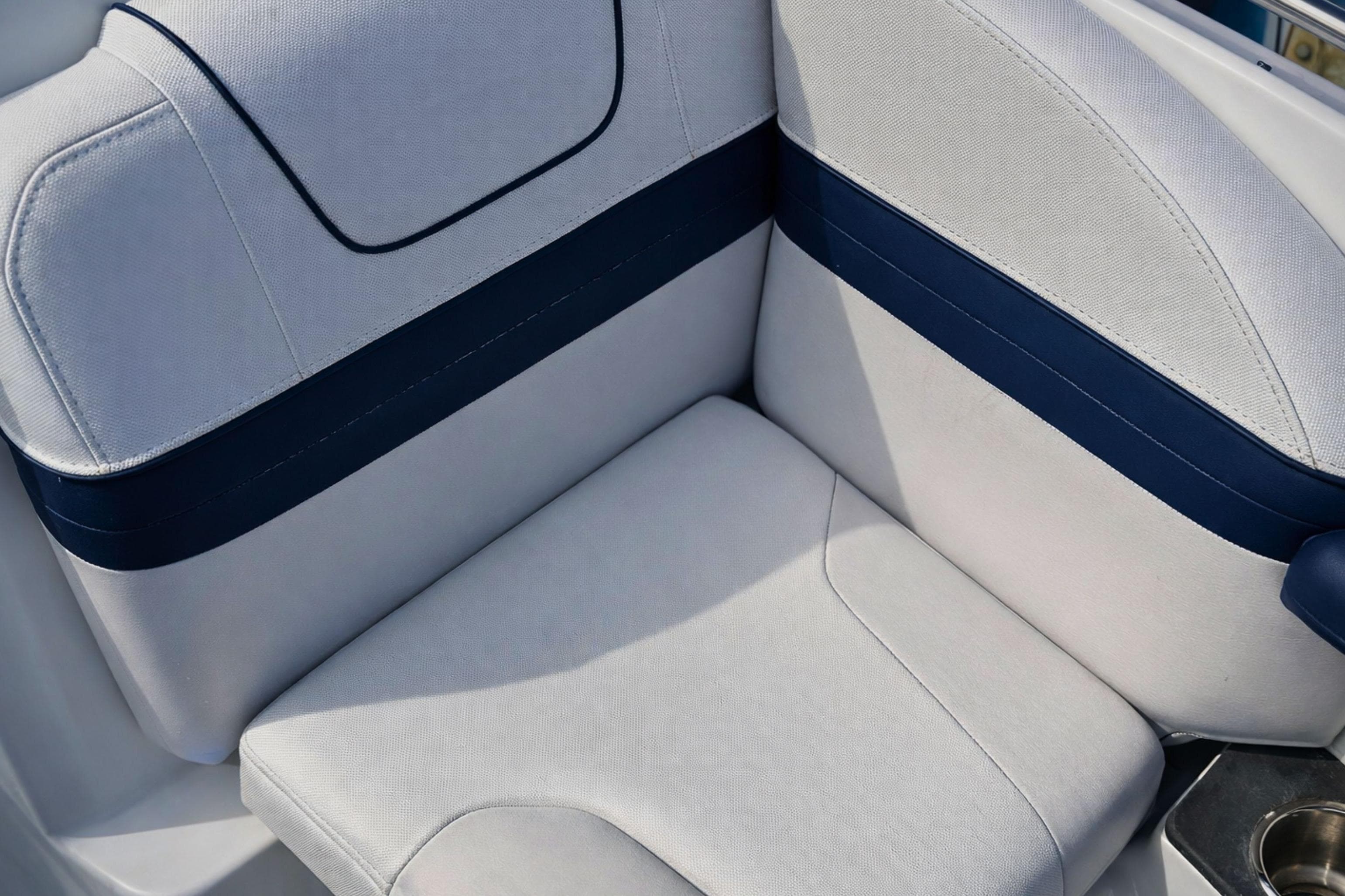 2015 Formula 240 Bowrider boat seat with blue and white upholstery.