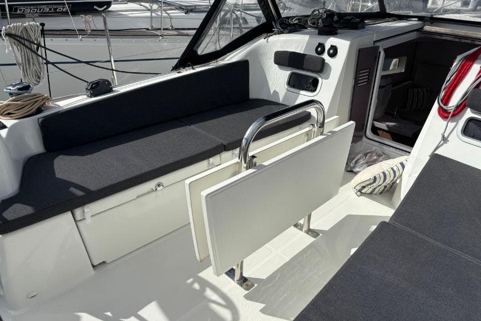Interior view of 2023 Jeanneau Sun Odyssey 380 sailboat cockpit seating area.