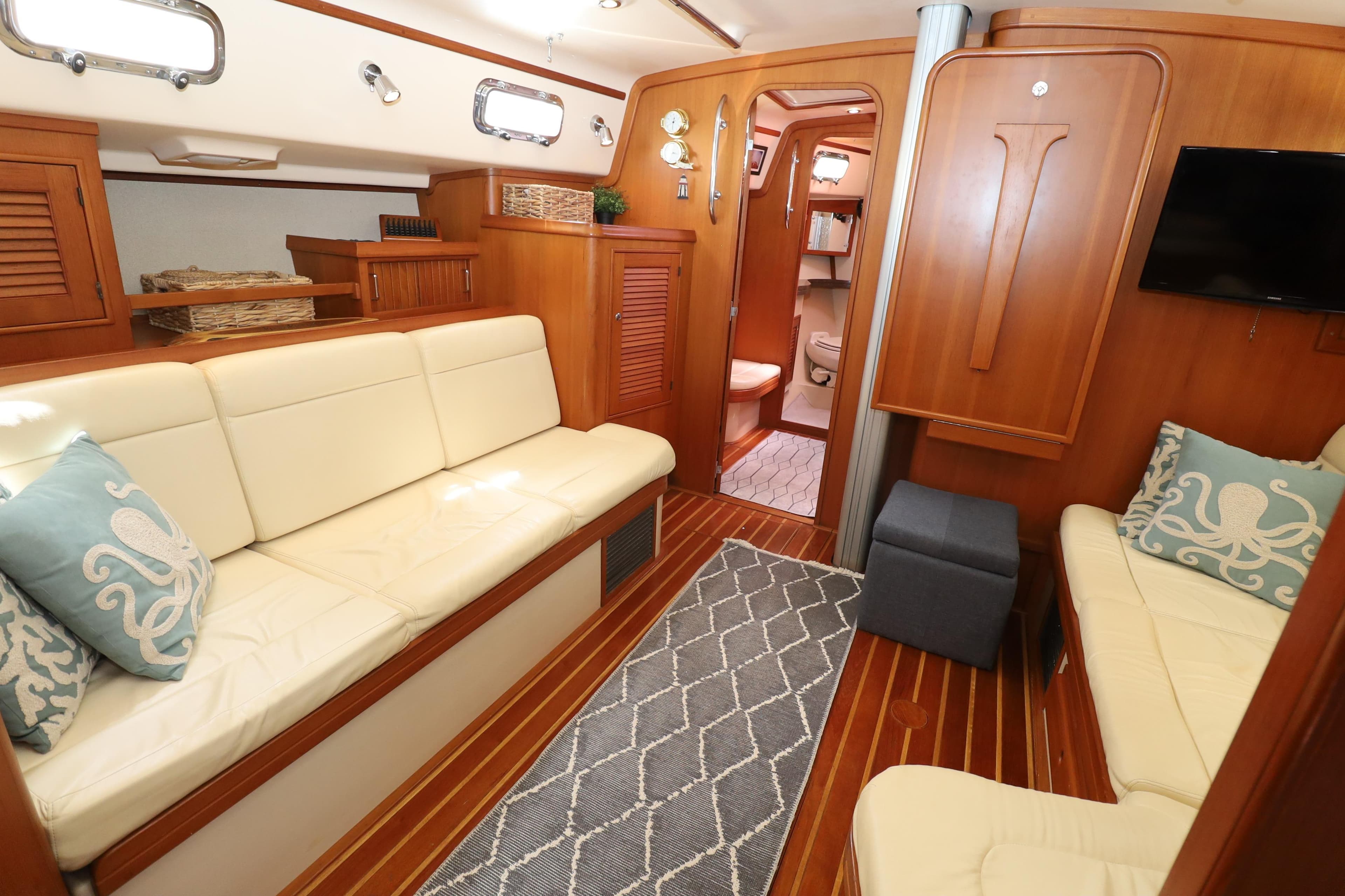Luxurious 2006 Island Packet 440 yacht interior with elegant wood finish and comfortable seating.