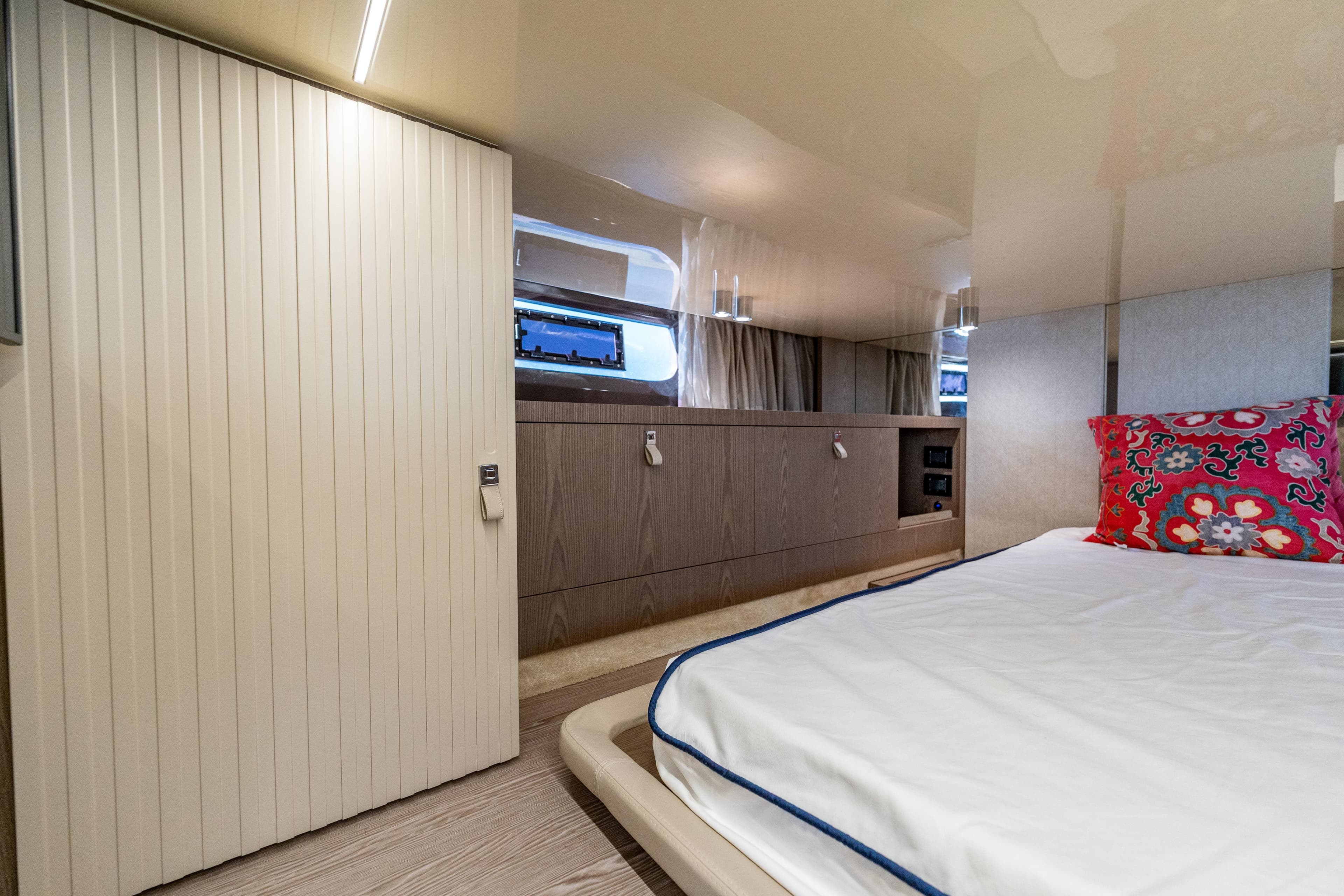 Luxurious interior of 2024 Invictus TT460 yacht with modern design and vibrant decor.