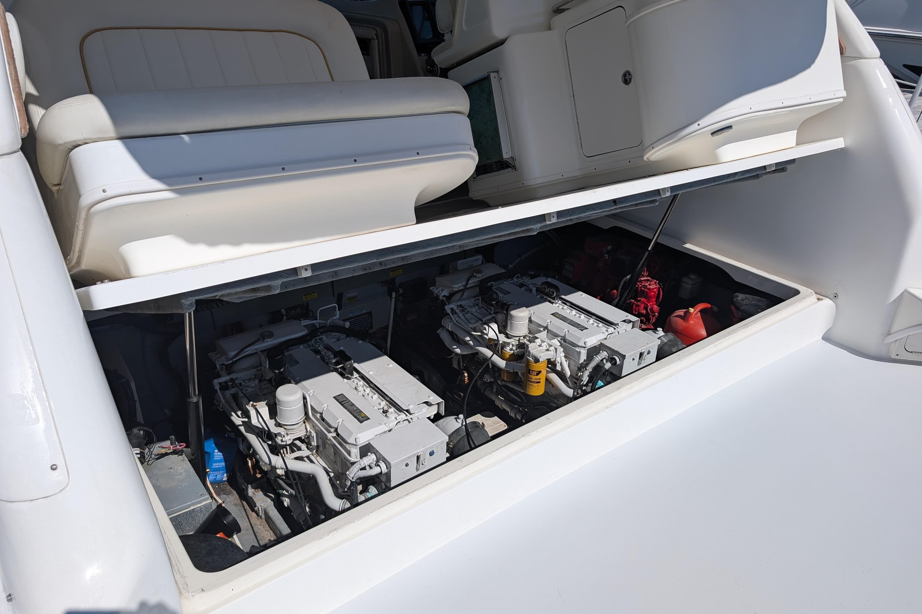 1999 Sea Ray 370 Express Cruiser engine compartment with dual engines visible.