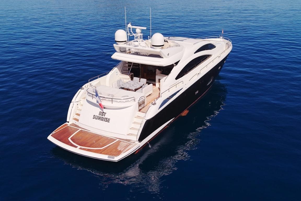 Sunseeker Predator 84 yacht, 2011 model, cruising on calm blue waters.