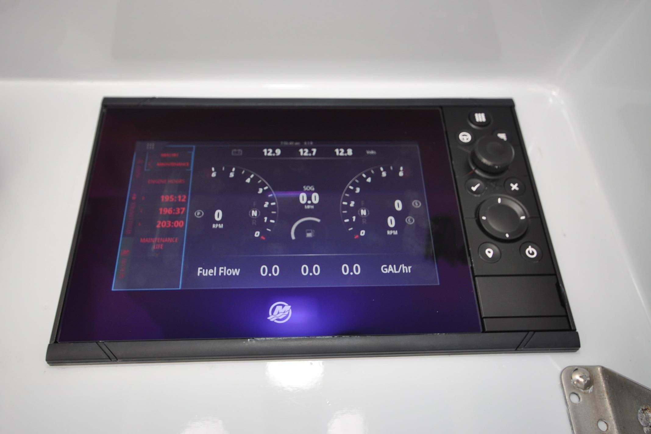 Digital dashboard display on a 2011 Yellowfin 39 Offshore boat, showing RPM and fuel flow.